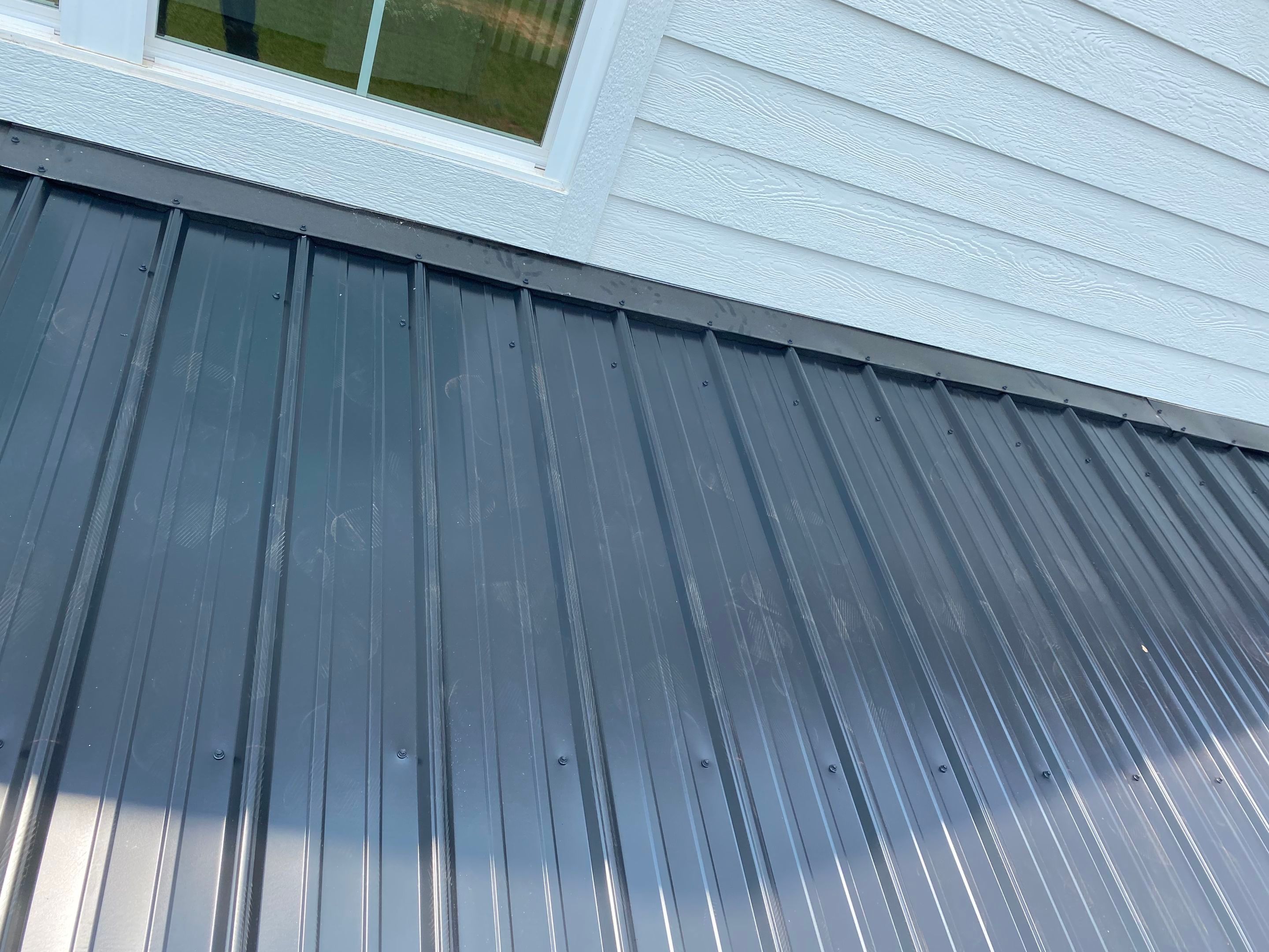 Jason's metal porch roof by BROCK BUILDERS 
