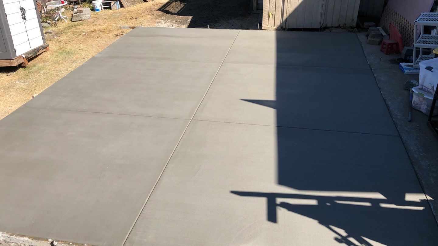 Oscar | Concrete Driveway  by Jireh Asphalt & Concrete Inc 