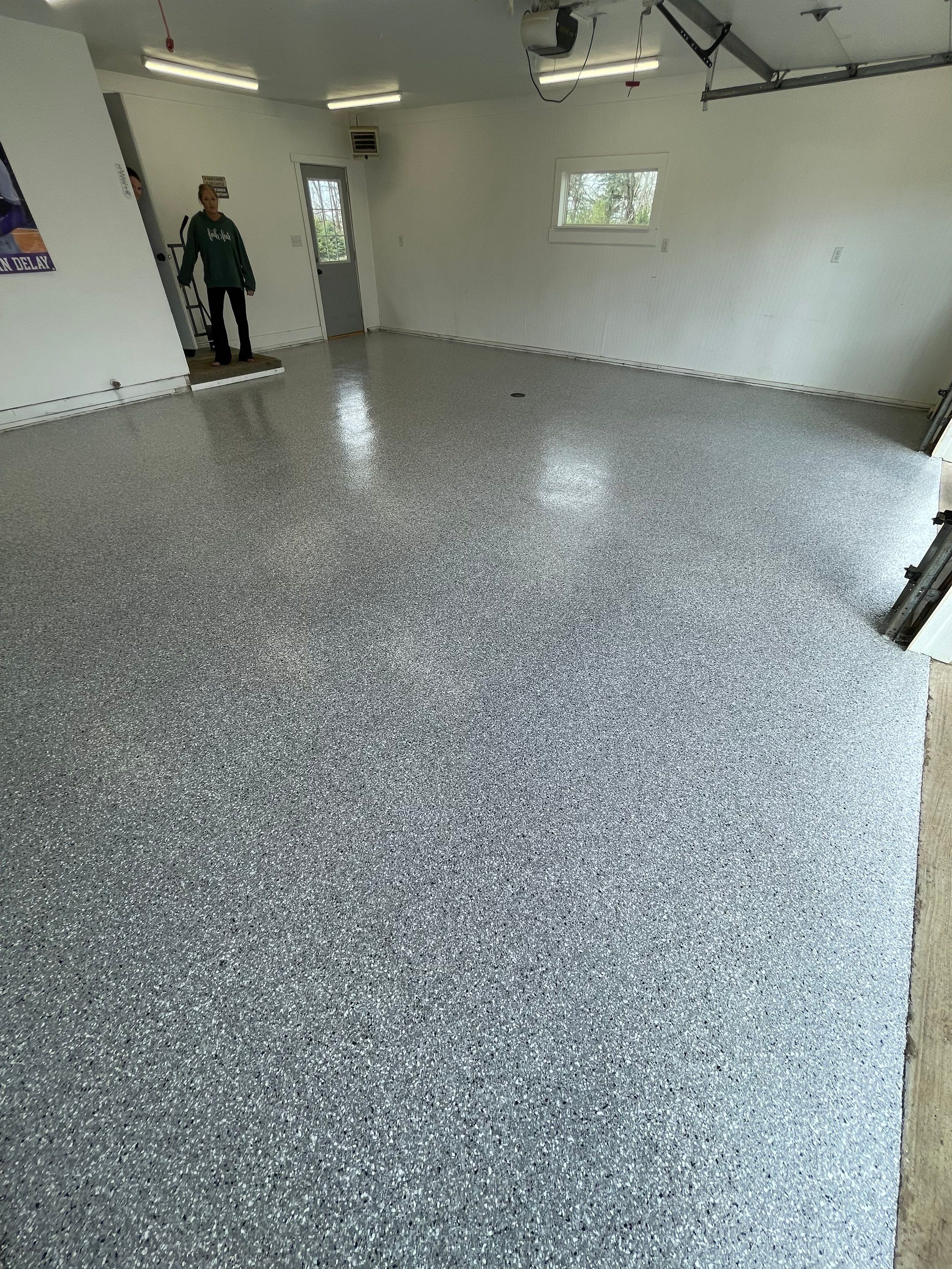 Feather Grey Garage Floor Coating and Crack Repair in Beresford by Select Painting, Coatings & Garage Cabinets