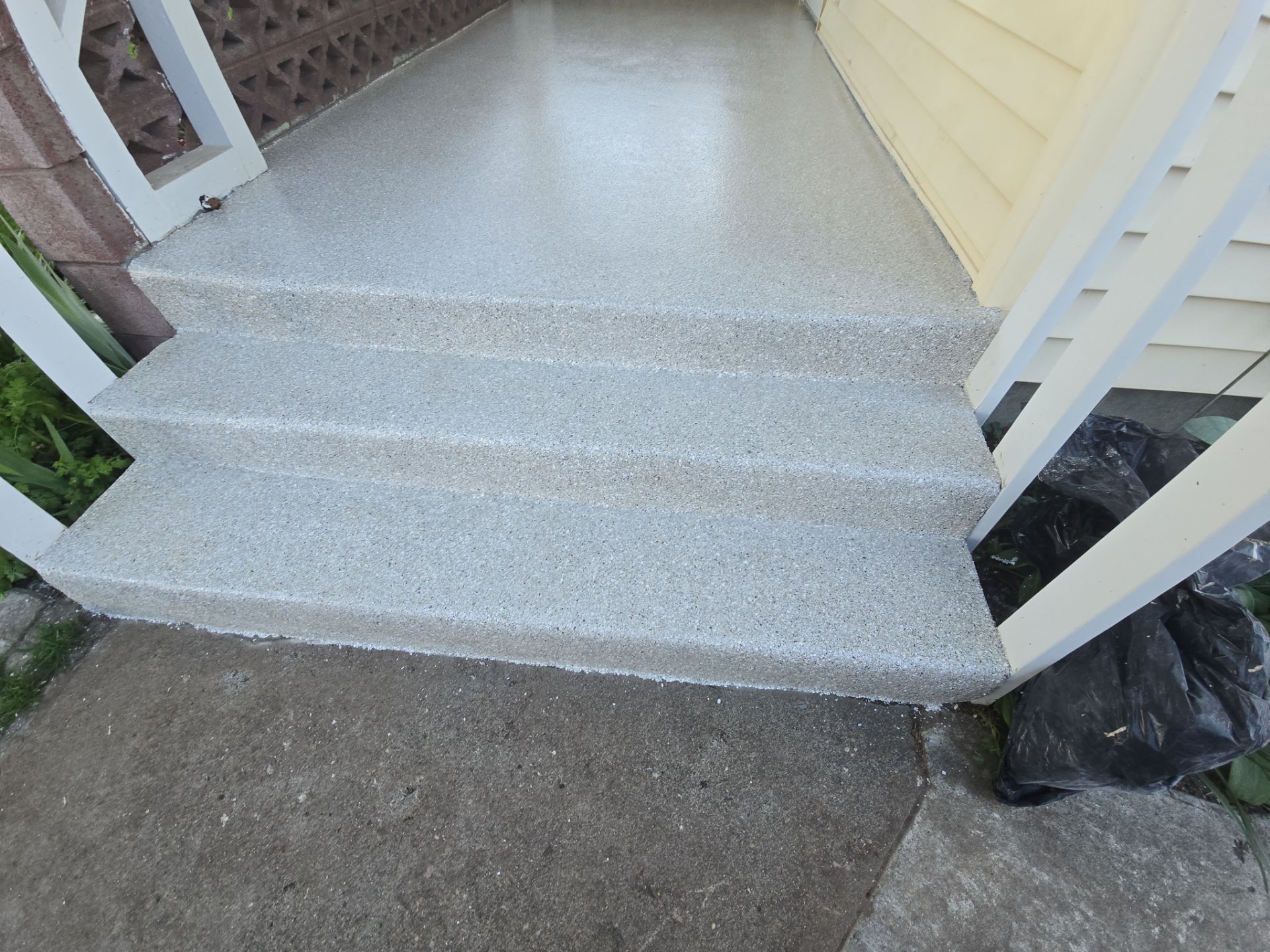 Limestone Hybrid Concrete Porch and Step Transformation in Richland by Croc Coatings, LLC
