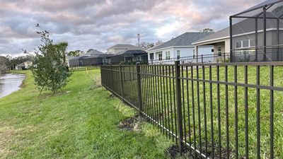 Aluminum Fence Installation using Black 3 Rail Aluminum Fence