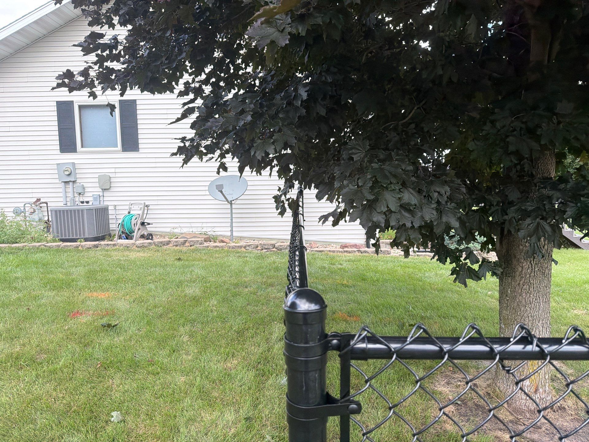 Black Vinyl-Coated Chain Link Fence Installation in Fairbank by Perfect Picket Fence and Stain