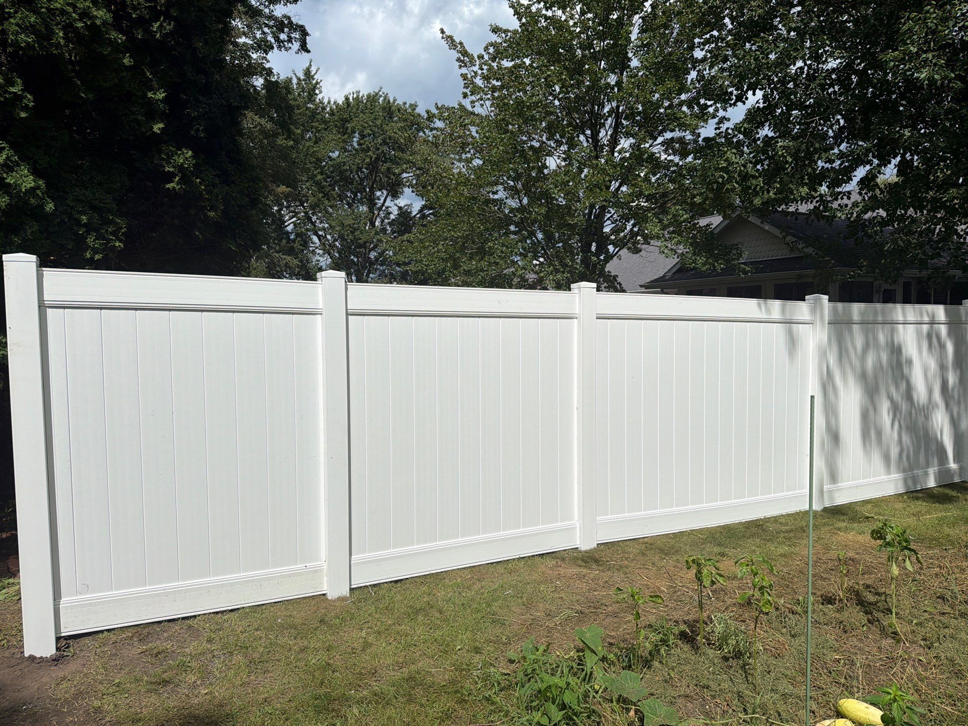 Residential White Vinyl Privacy and Black Chain Link Fencing in Jesup by Perfect Picket Fence and Stain