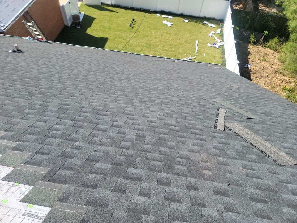 Residential Roofing Installation using Roof Replacement by American Roofing & Construction LLC