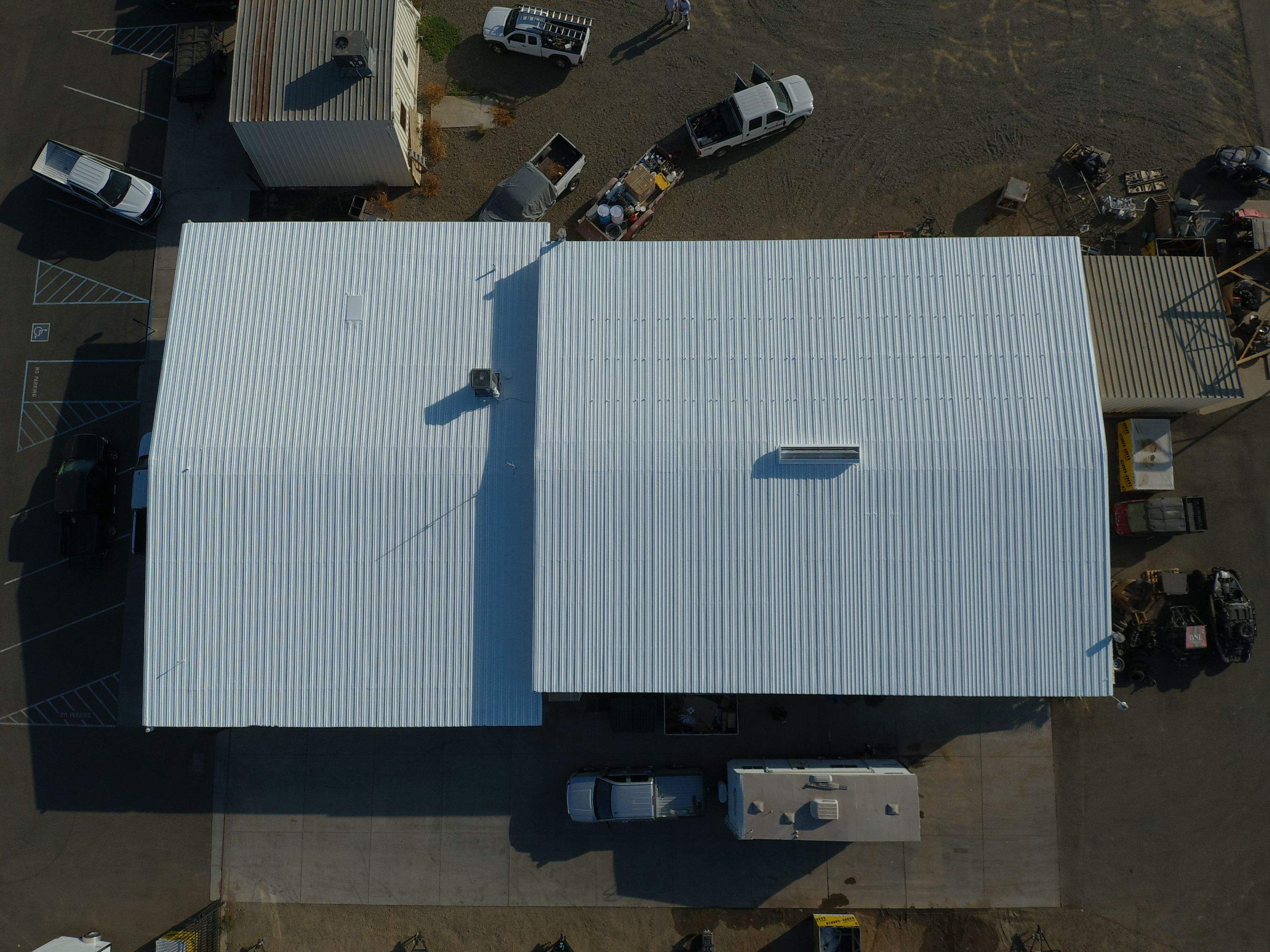 Metal Restoration Roofing system with Benchmark/PUMA XL 20 yr warranty by Straight Edge Roofing Inc