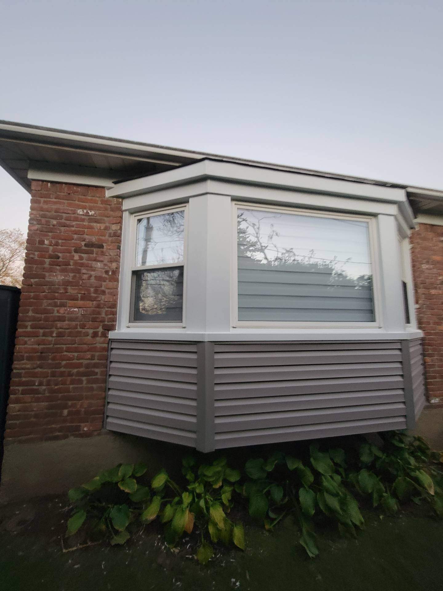 New Siding & Trim by Island Roofing Inc.