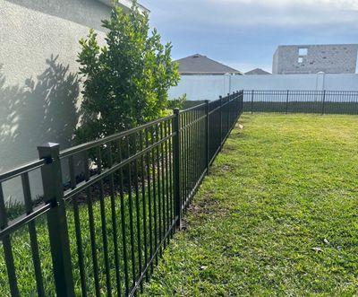 Aluminum Fence Installation using Black 3 Rail Aluminum Fence