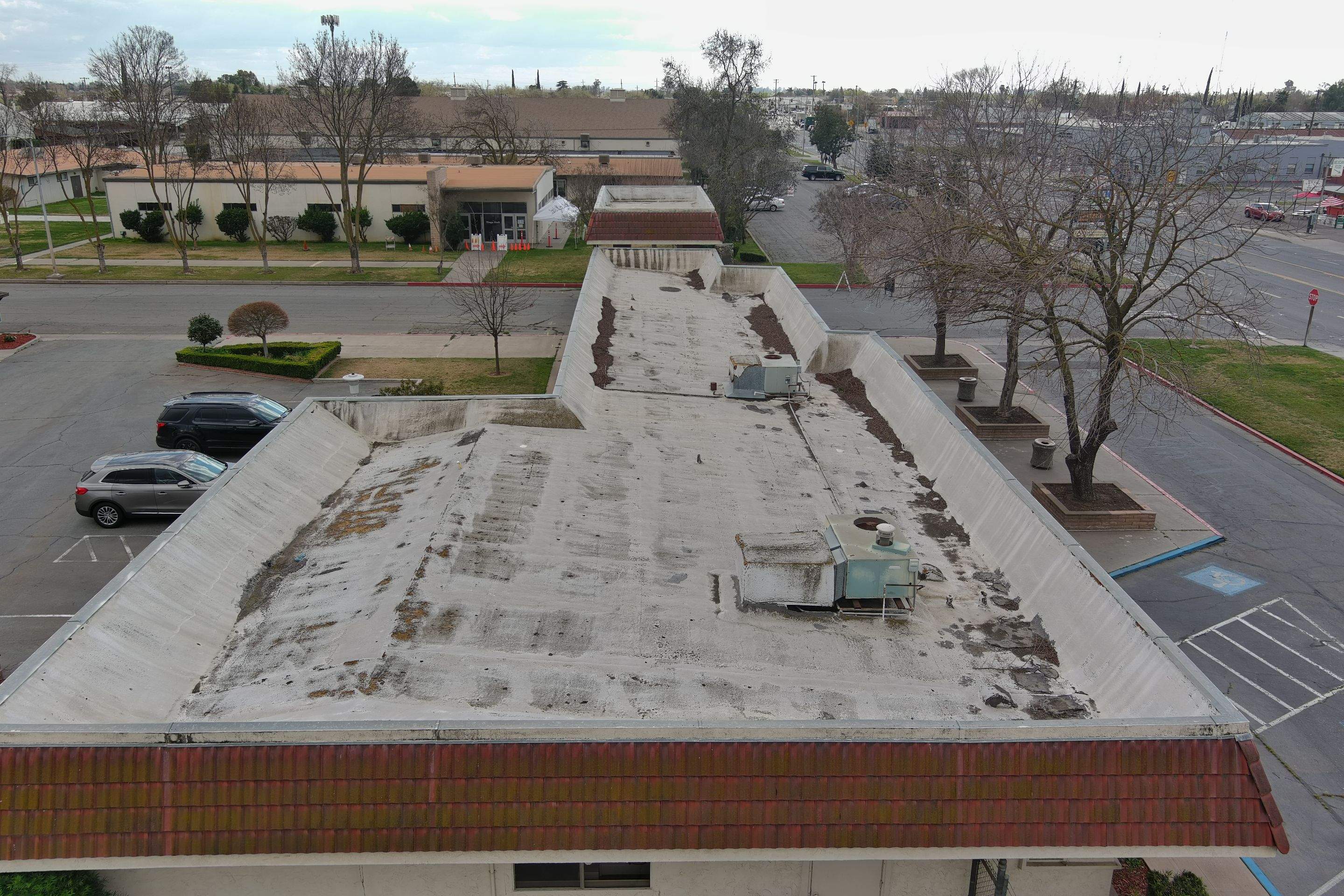 Commercial Roofing Installation using General Coatings acrylic coatings and spray foam by Straight Edge Roofing Inc