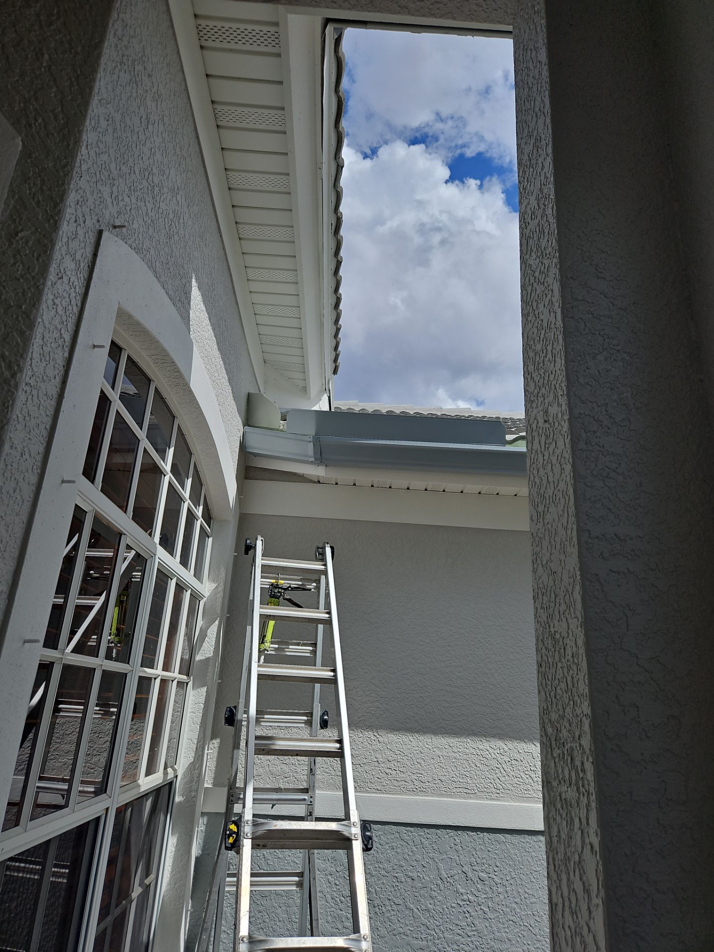 6-inch K-style Seamless Gutters and Splash Guard in Grey Color in Naples FL by Gutter Professors