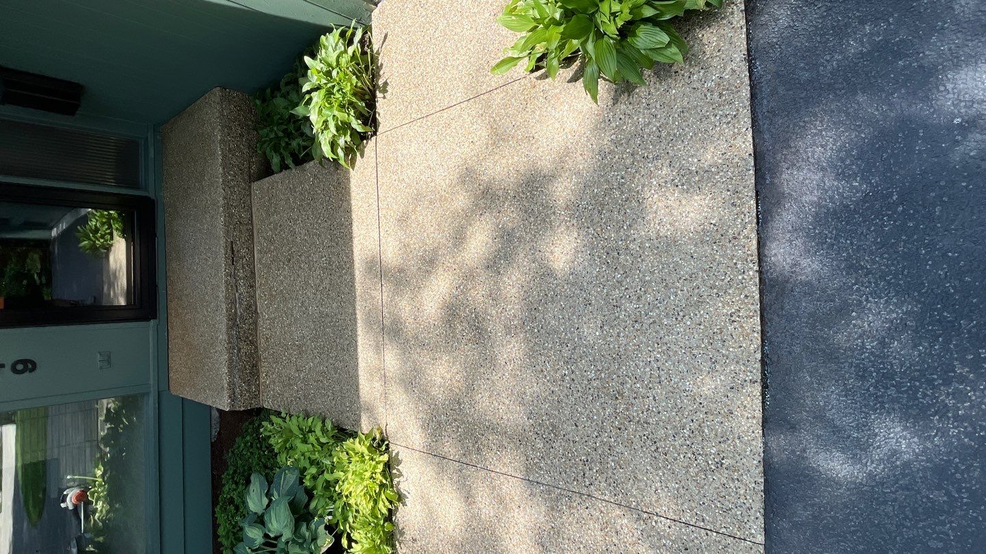 Aggregate concrete cleaning and sealing using Surebond SB-9000 by Northern Power Washing LLC.