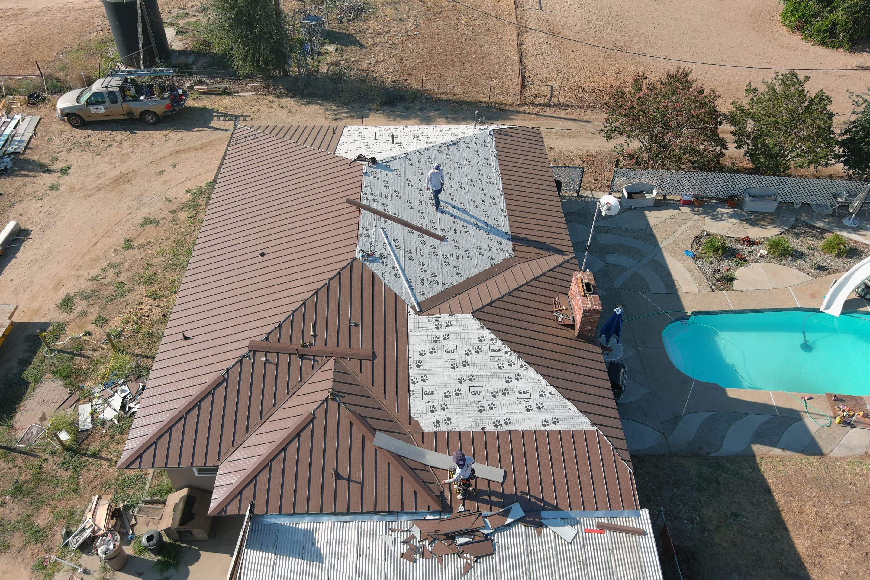 Metal roofing installation using Standing seam metal roofing system by Straight Edge Roofing Inc