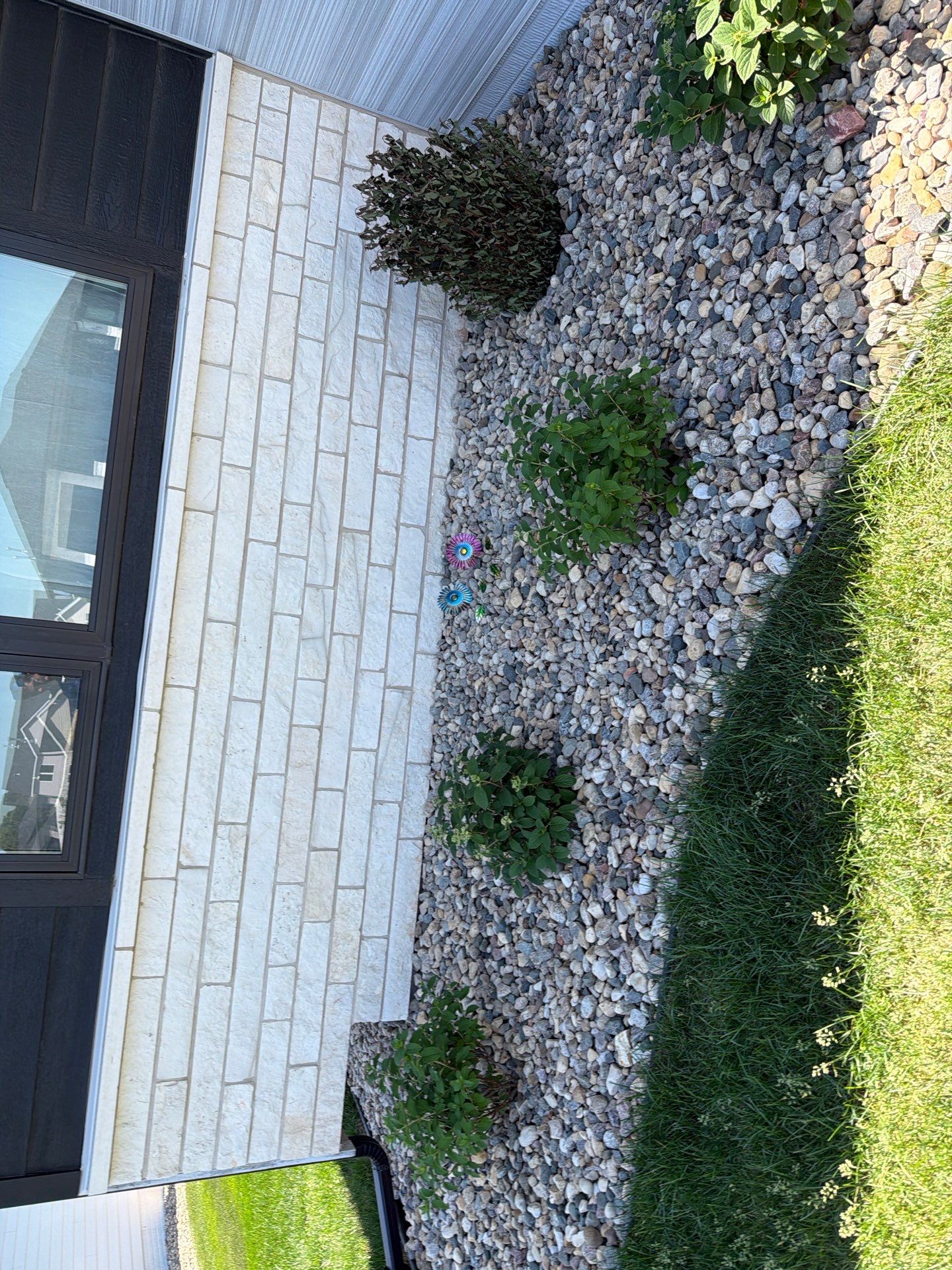 Modern Exterior Update with Siding and Stone Masonry in Sioux Falls by Select Painting, Coatings & Garage Cabinets