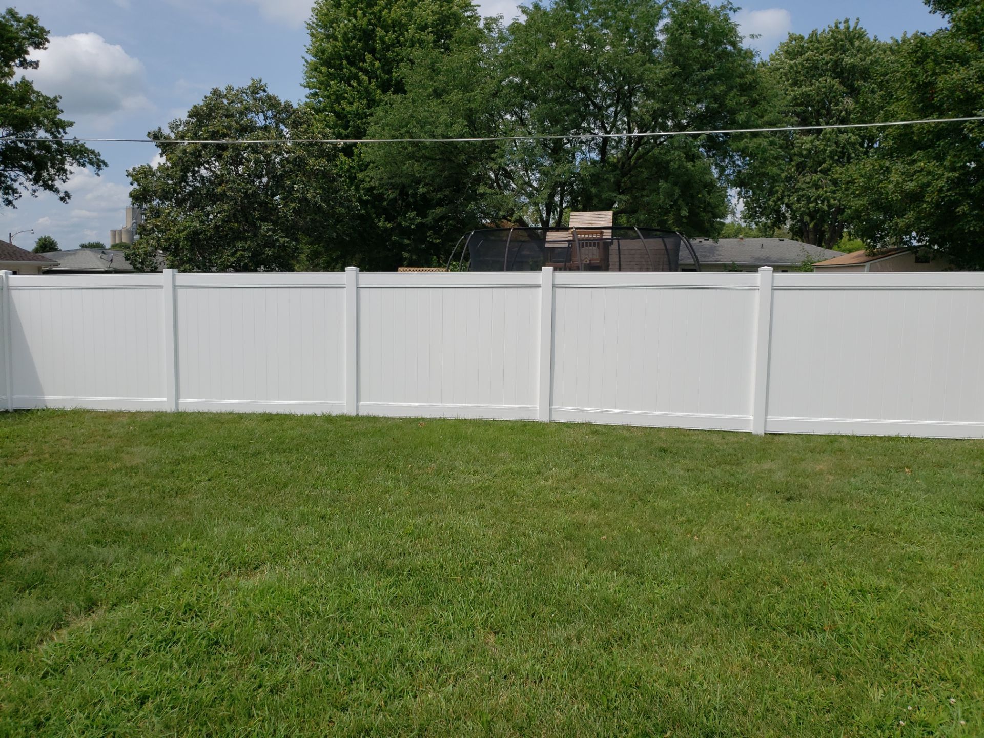 White Vinyl Privacy Fence Installation in Grundy Center by Perfect Picket Fence and Stain