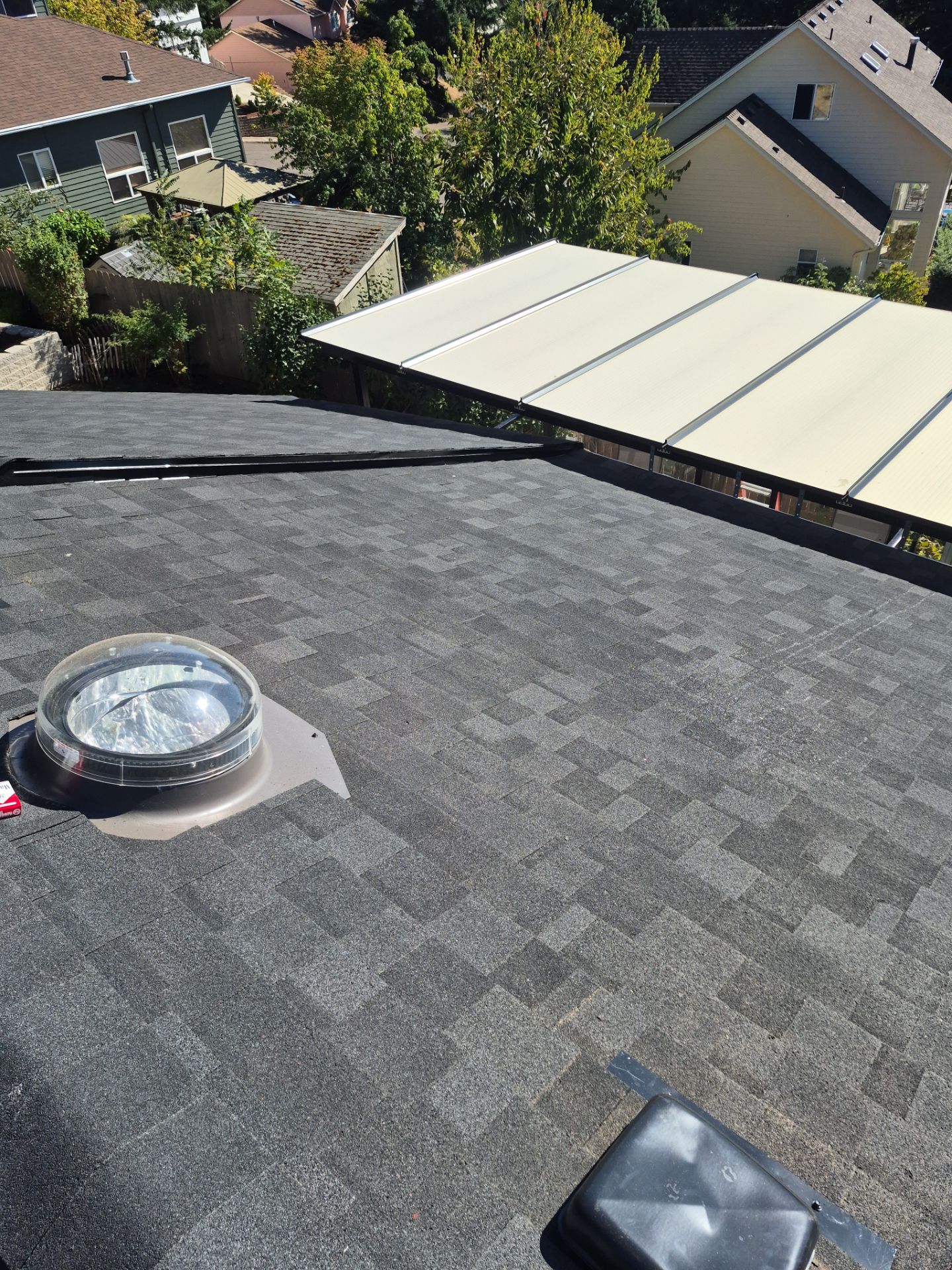 Granite Black Residential Roof Replacement by Orezona Building & Roofing Company, Inc.