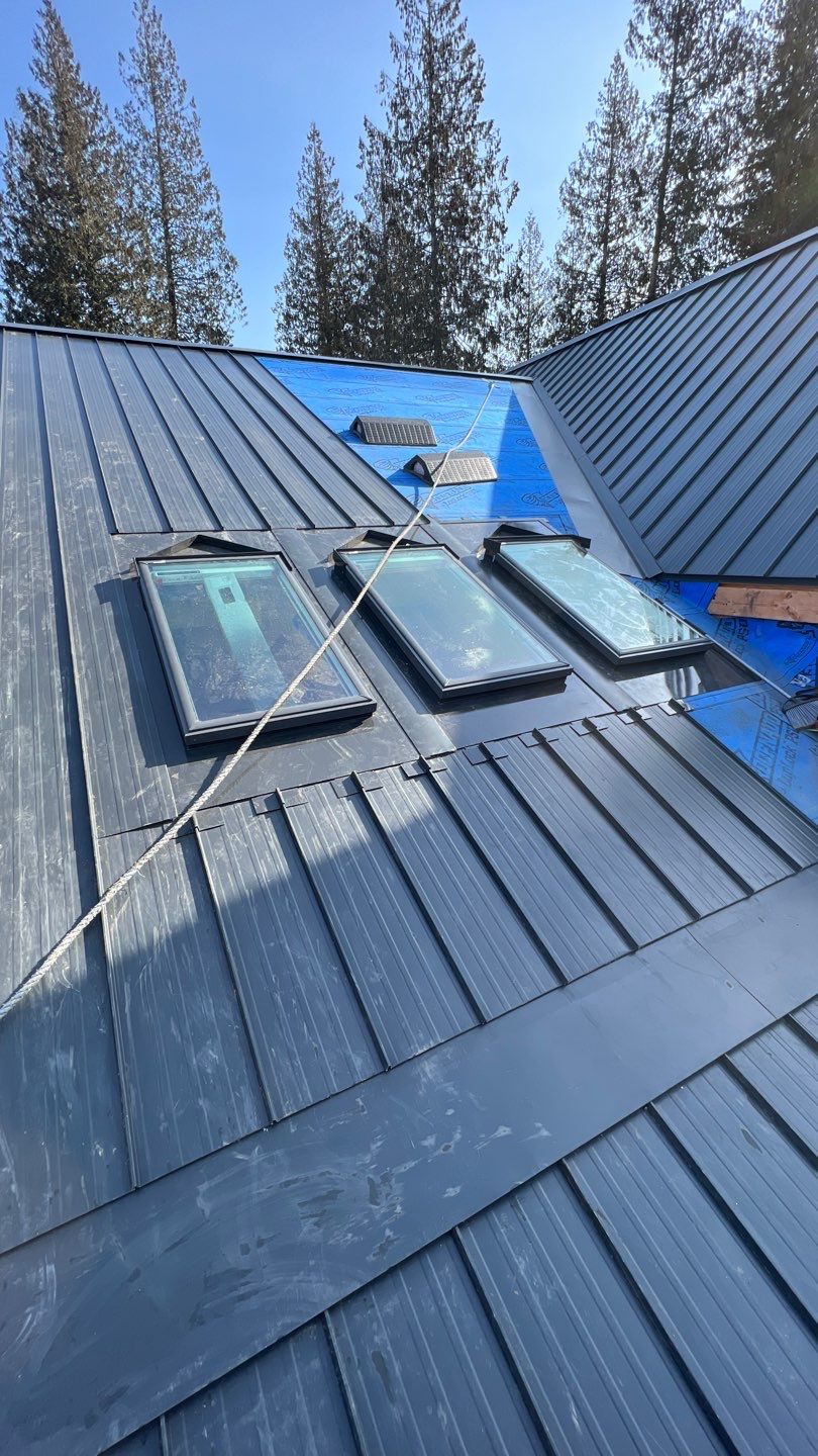 Residential Roofing Installation using 12" Prolok metal by Top Notch Roofing Inc