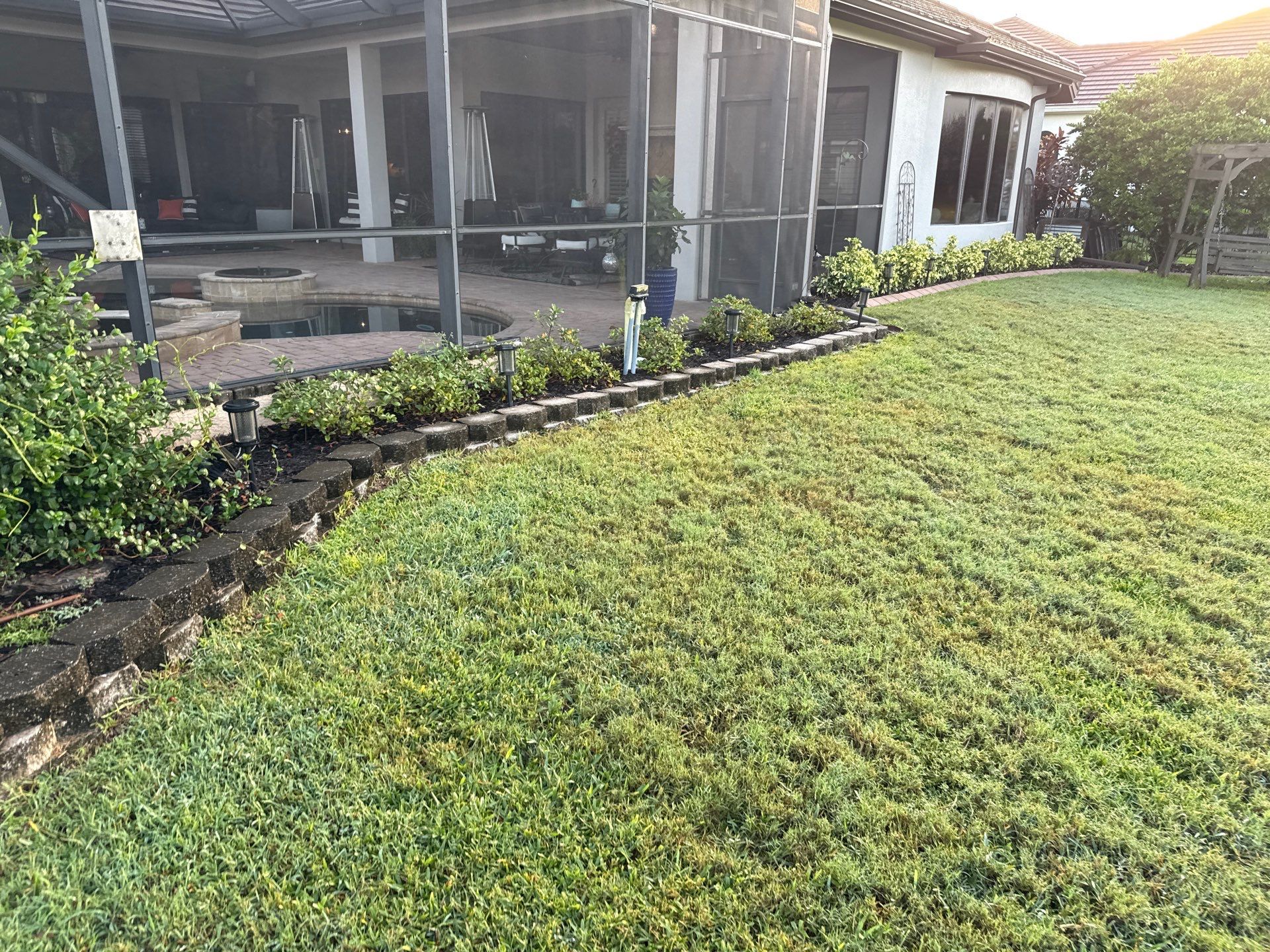 Tile Roof, Paver Pool Deck & Flowerbed Curbing Cleaning | Winding River Bradenton, FL Transformation by Sunshine AquaWash