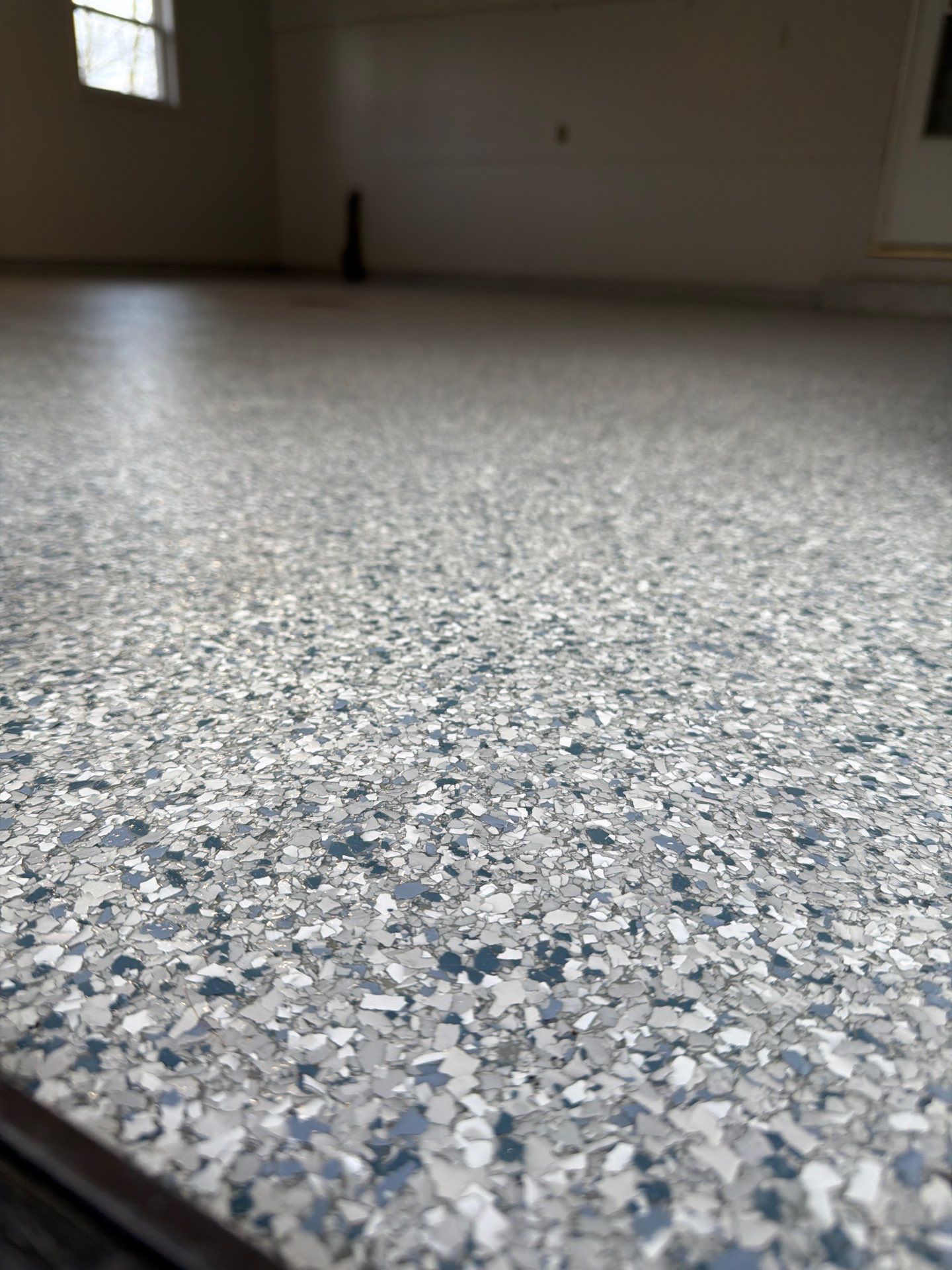Muskegon Garage Interior Painting and Epoxy Flake Floor Installation by Gordon Painting