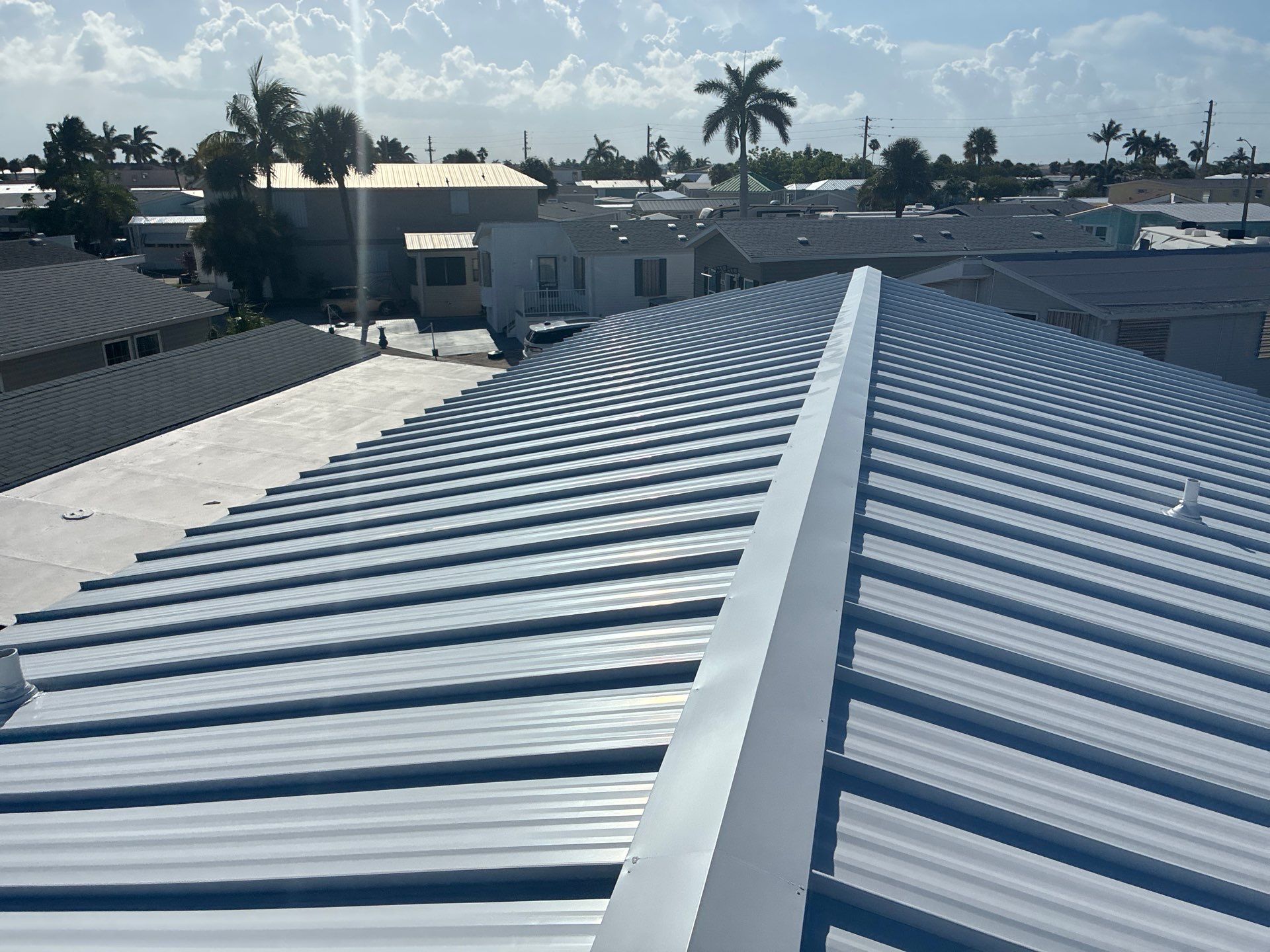 .032 Aluminum 1.5" Mechanical Seam Regal White  by Total Roofing System The Metal Roof Experts