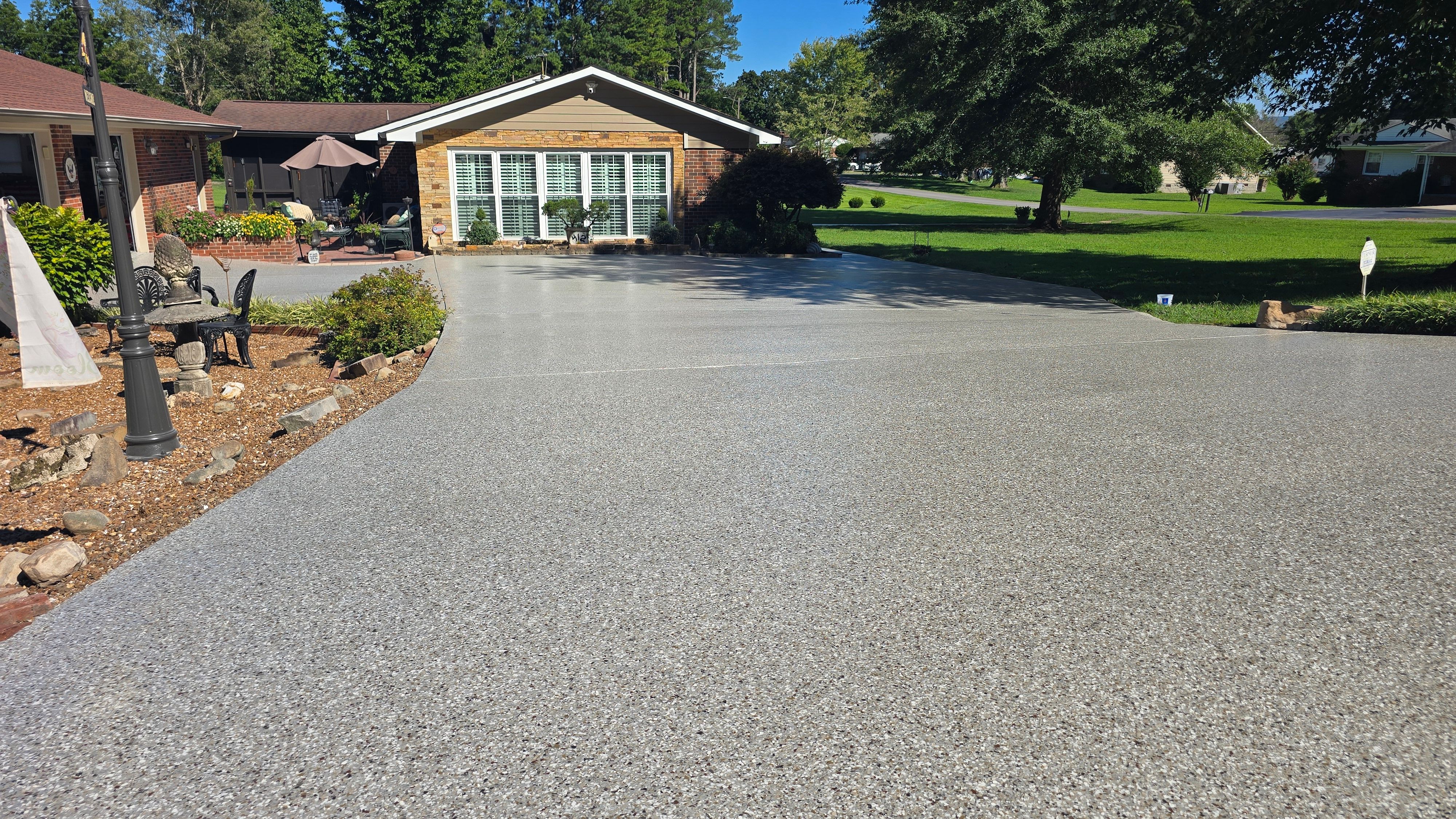 Driveway, Garage, Porch, and Sidewalk using Creekbed by Elite Floor Solutions
