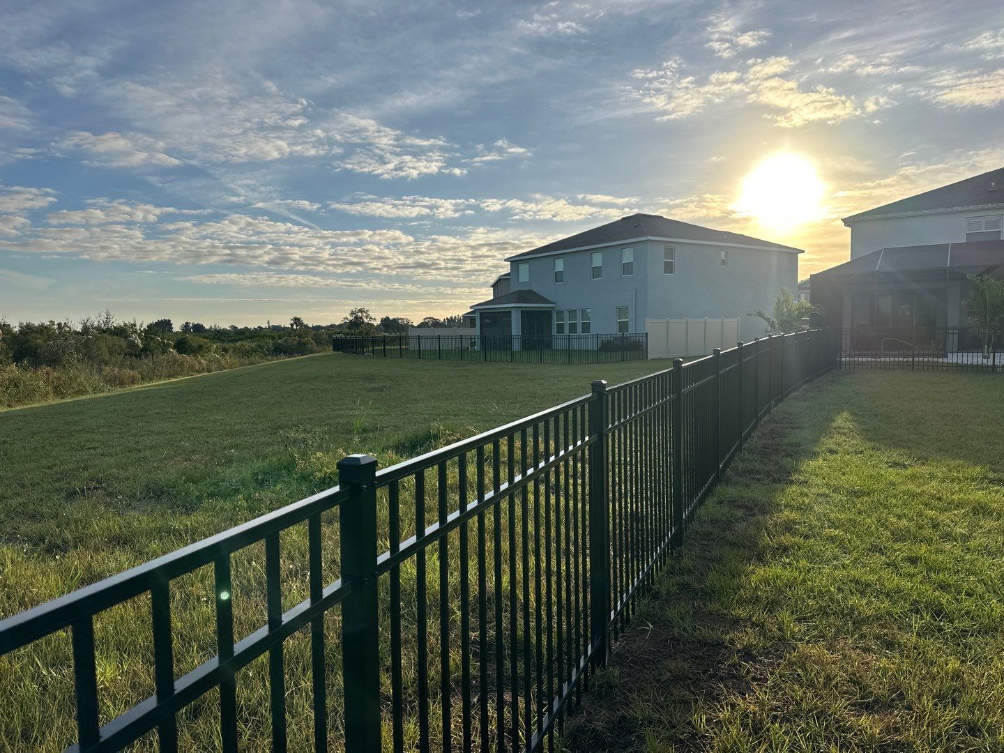 Vinyl Fence Installation using Vinyl Fence and a Black 3 Rail Aluminum Fence by Asap fence and gates, LLC