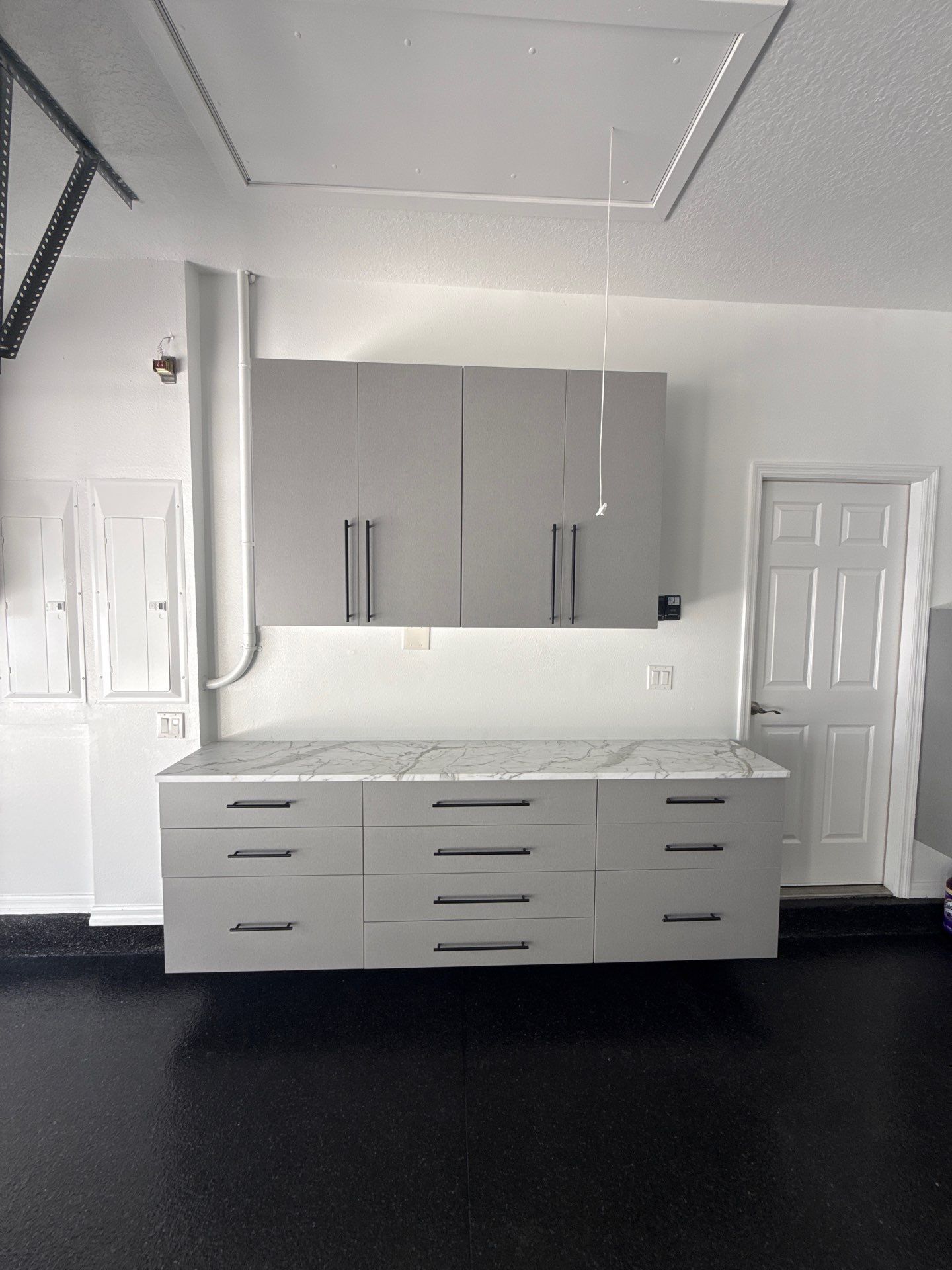 Tampa Garage Floor Coating and Overhead Storage Rack Installation by Square 1 Garage and Closet Solutions