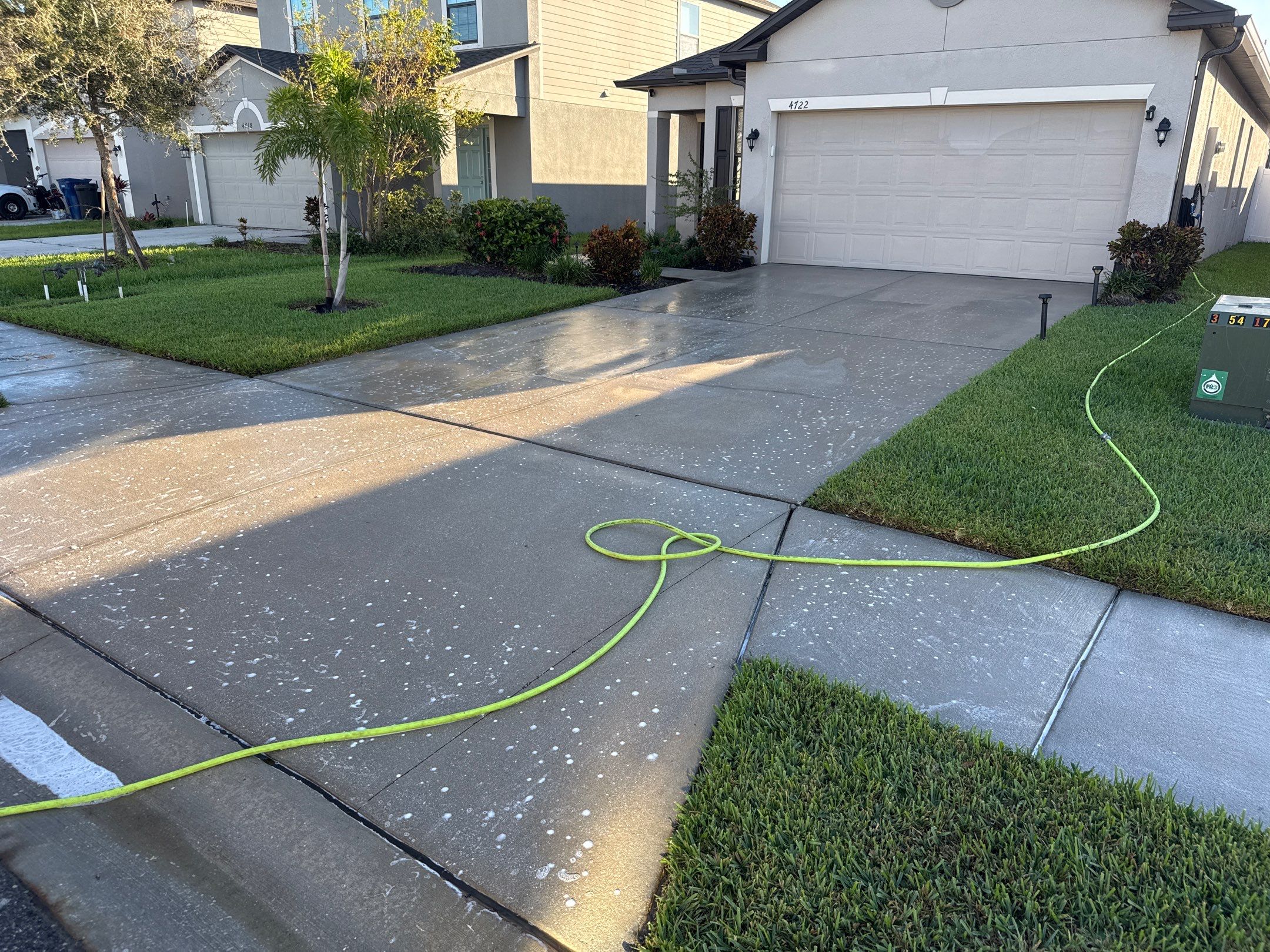 Concrete Driveway, Sidewalk, Street Curbing, and Entryway Cleaning in Willow Walk Community, Palmetto, FL by Sunshine AquaWash