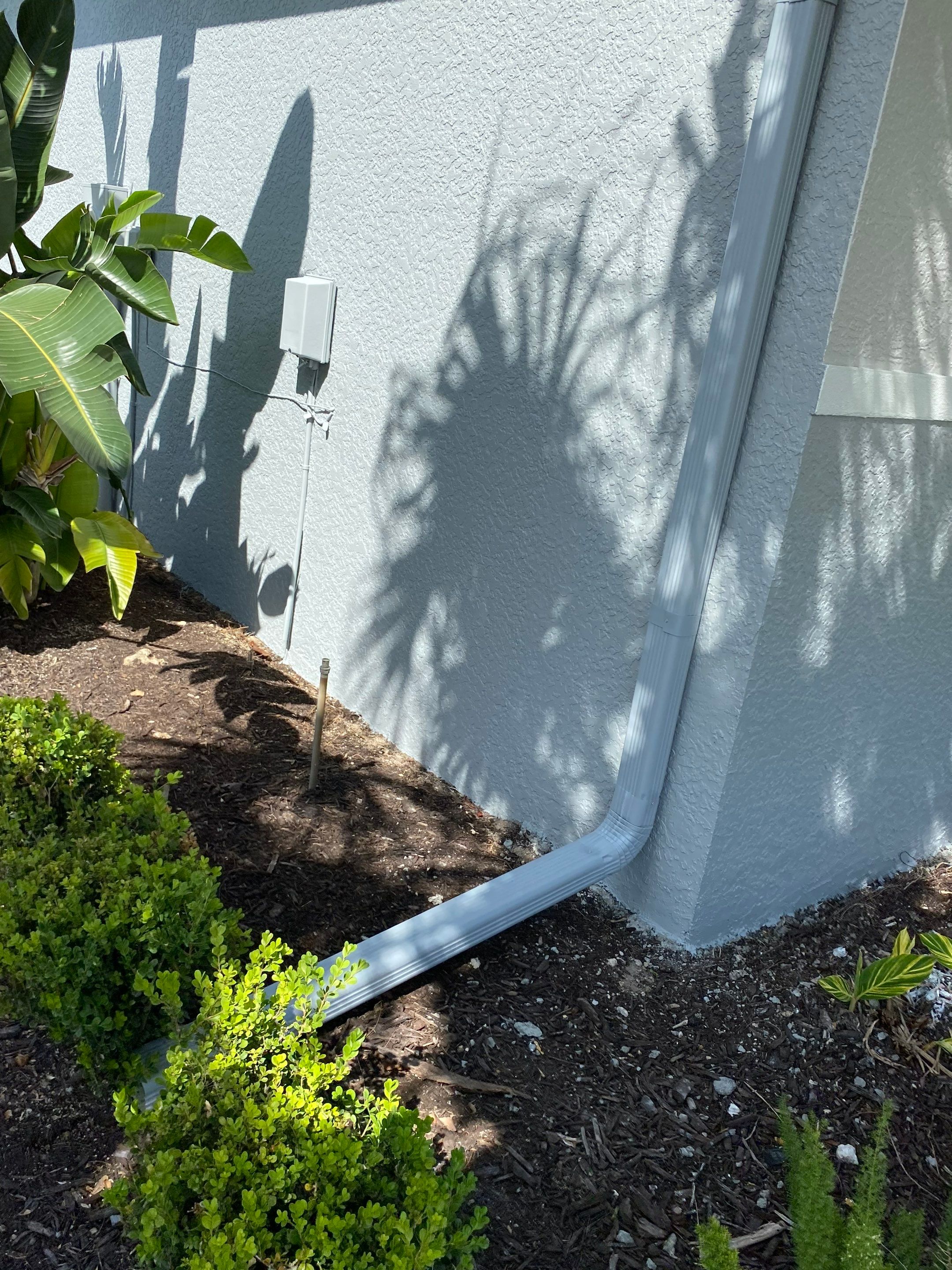 6-inch K-style Seamless Gutters and Splash Guard in Grey Color in Naples FL by Gutter Professors