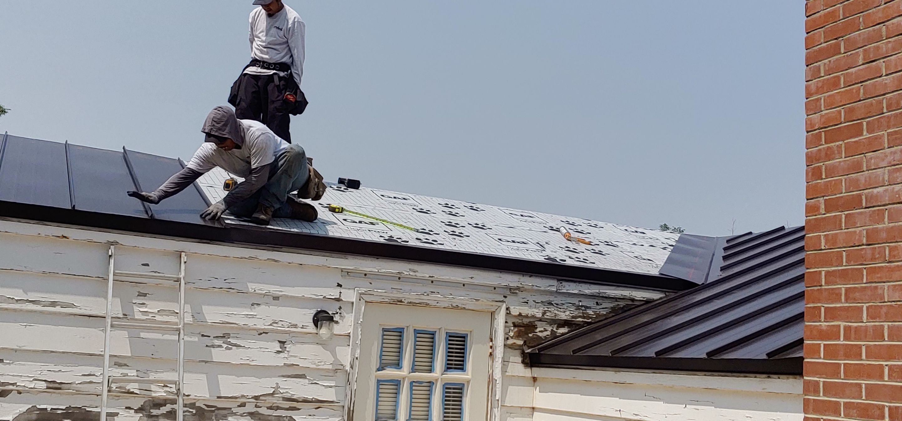 Residential Roofing Installation using Standing seam metal roofing system by Straight Edge Roofing Inc