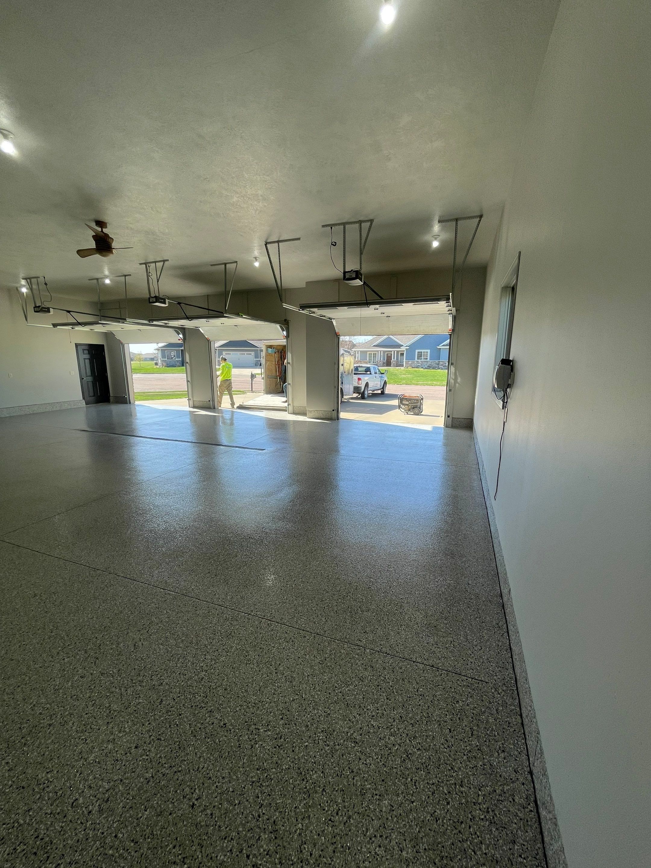 Multi-Car Garage Epoxy Floor Coating in Beresford by Select Painting, Coatings & Garage Cabinets