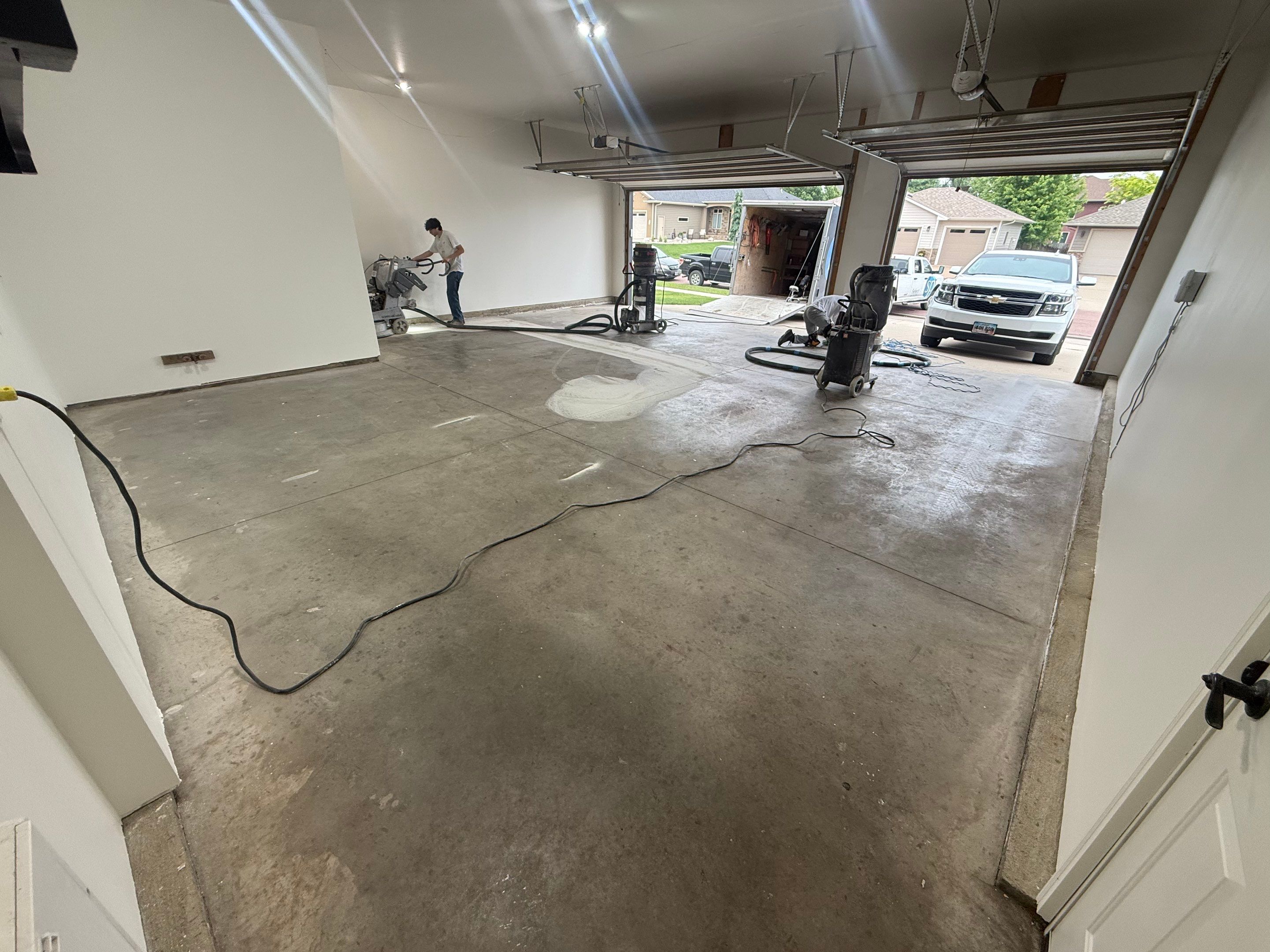 Full Garage Floor Resurfacing and Decorative Epoxy Flake Finish by Select Painting, Coatings & Garage Cabinets