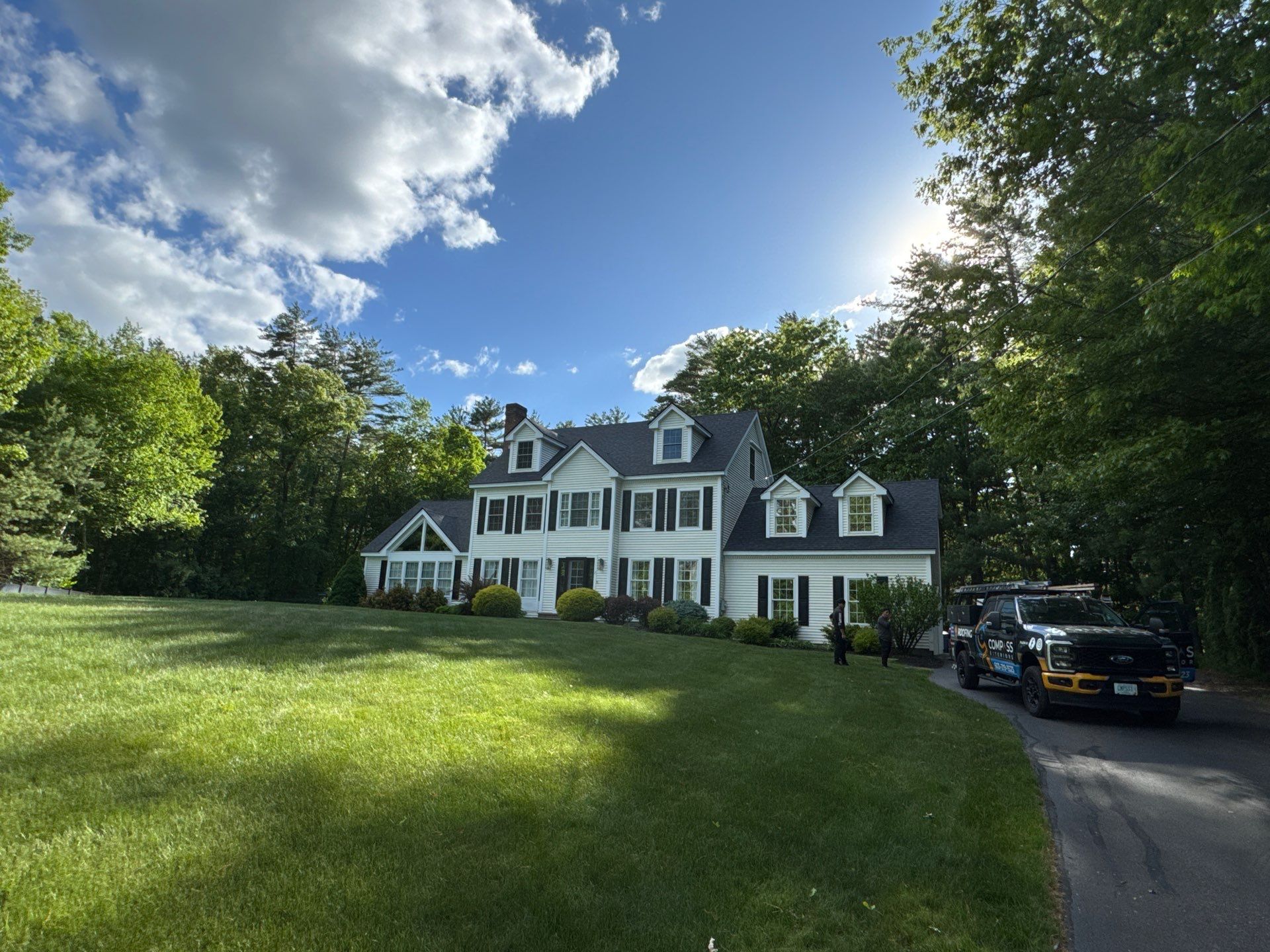 Roof Replacement on Cobbetts Pond in Windham, NH with Owens Corning Onyx Black Shingles by Compass exteriors