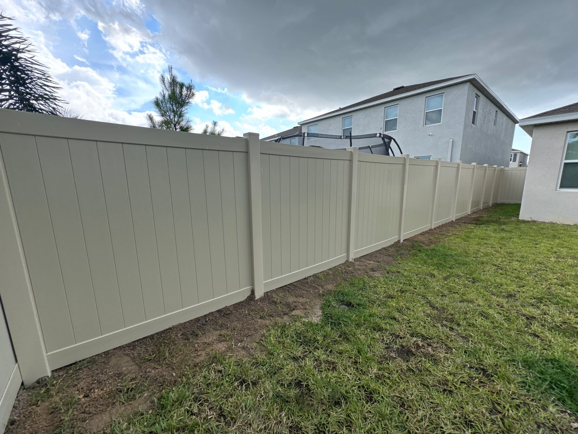 Vinyl Fence Installation using Tan Vinyl Privacy Fence by Asap fence and gates, LLC