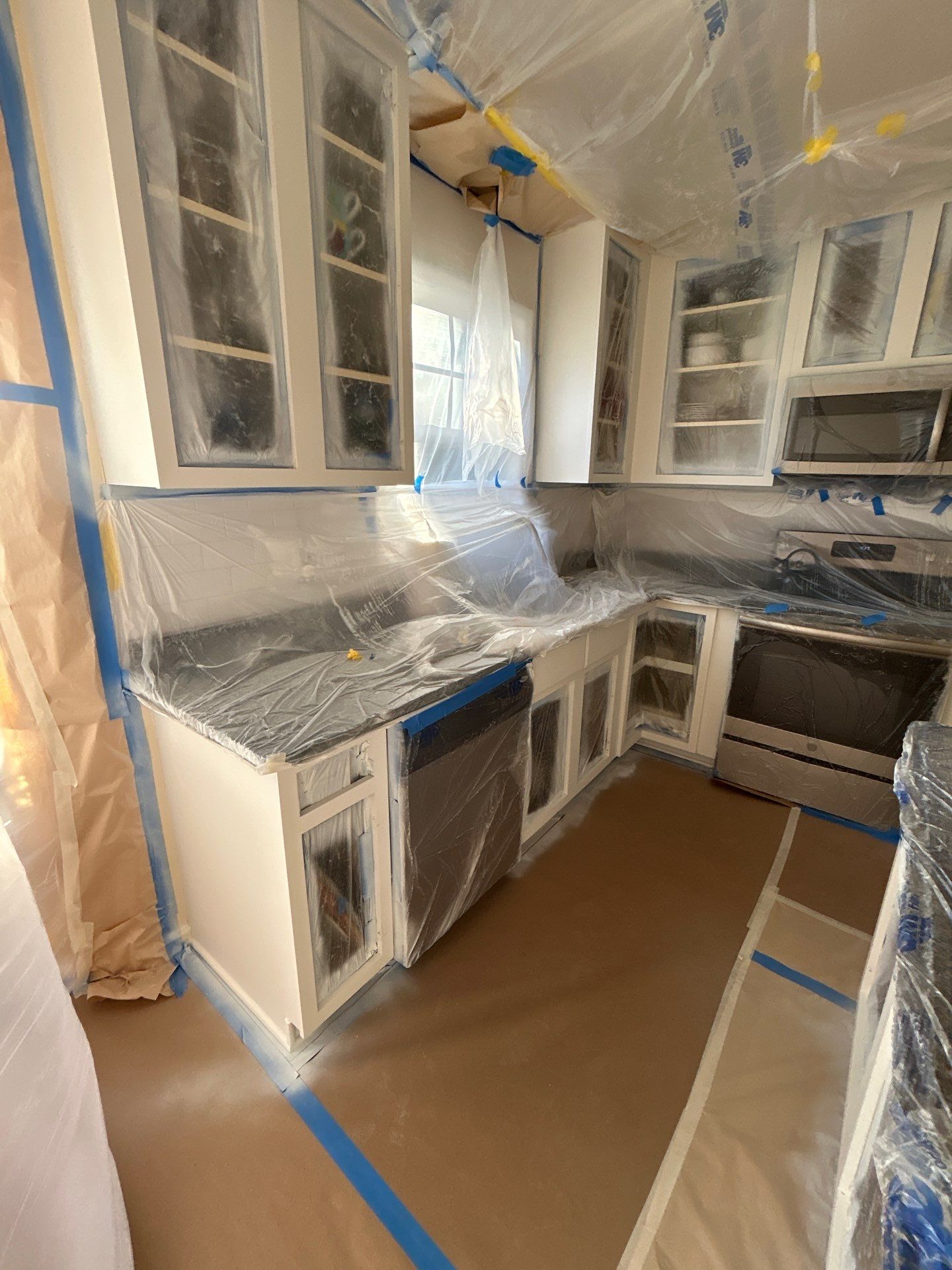 Cabinet painting by GonzalezPainters & Contractors Inc 