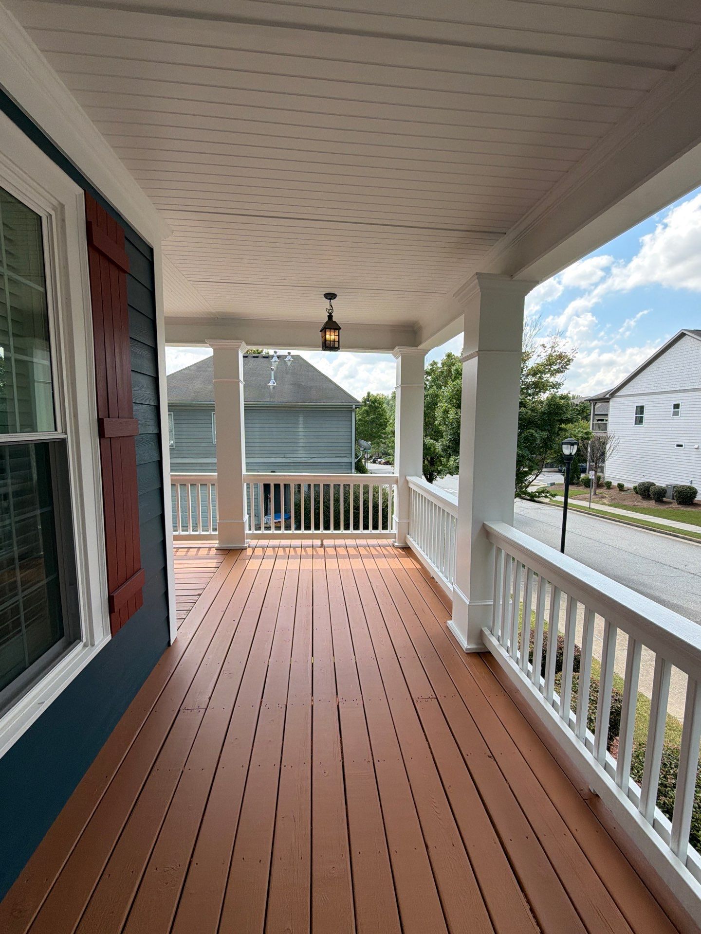 Atlanta Exterior Home Refresh with Blue Siding and Deck Staining by Swift Home Renovations 