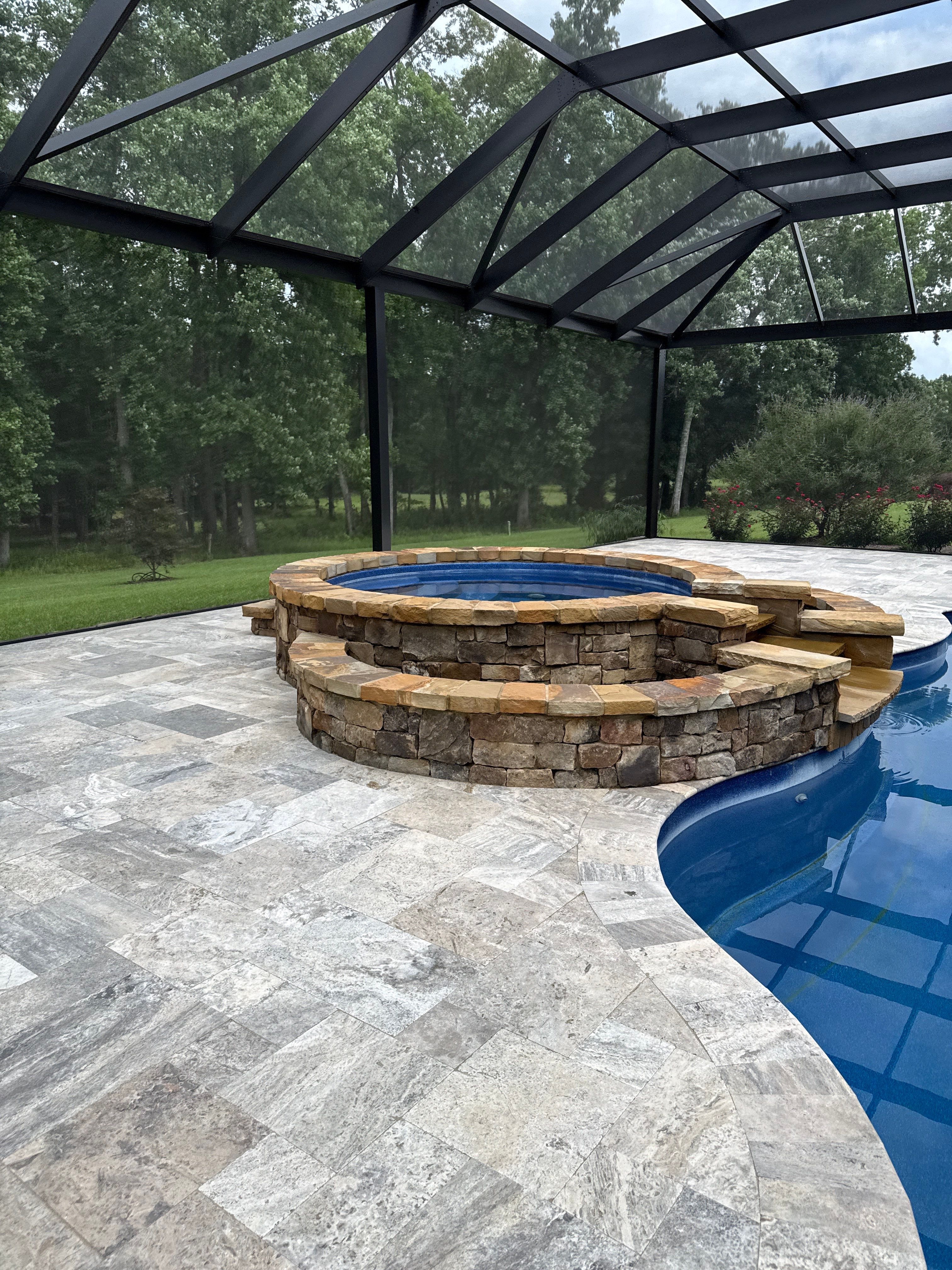 Travertine Patio and Natural Stone Spa in Brantley by Cornerstone Hard Surface Restoration 