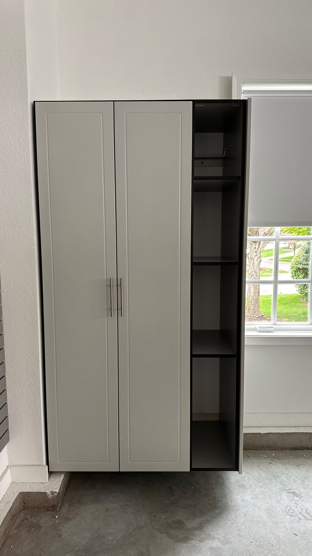 Brooke L. added cabinets for a clean storage look by Banner Garage