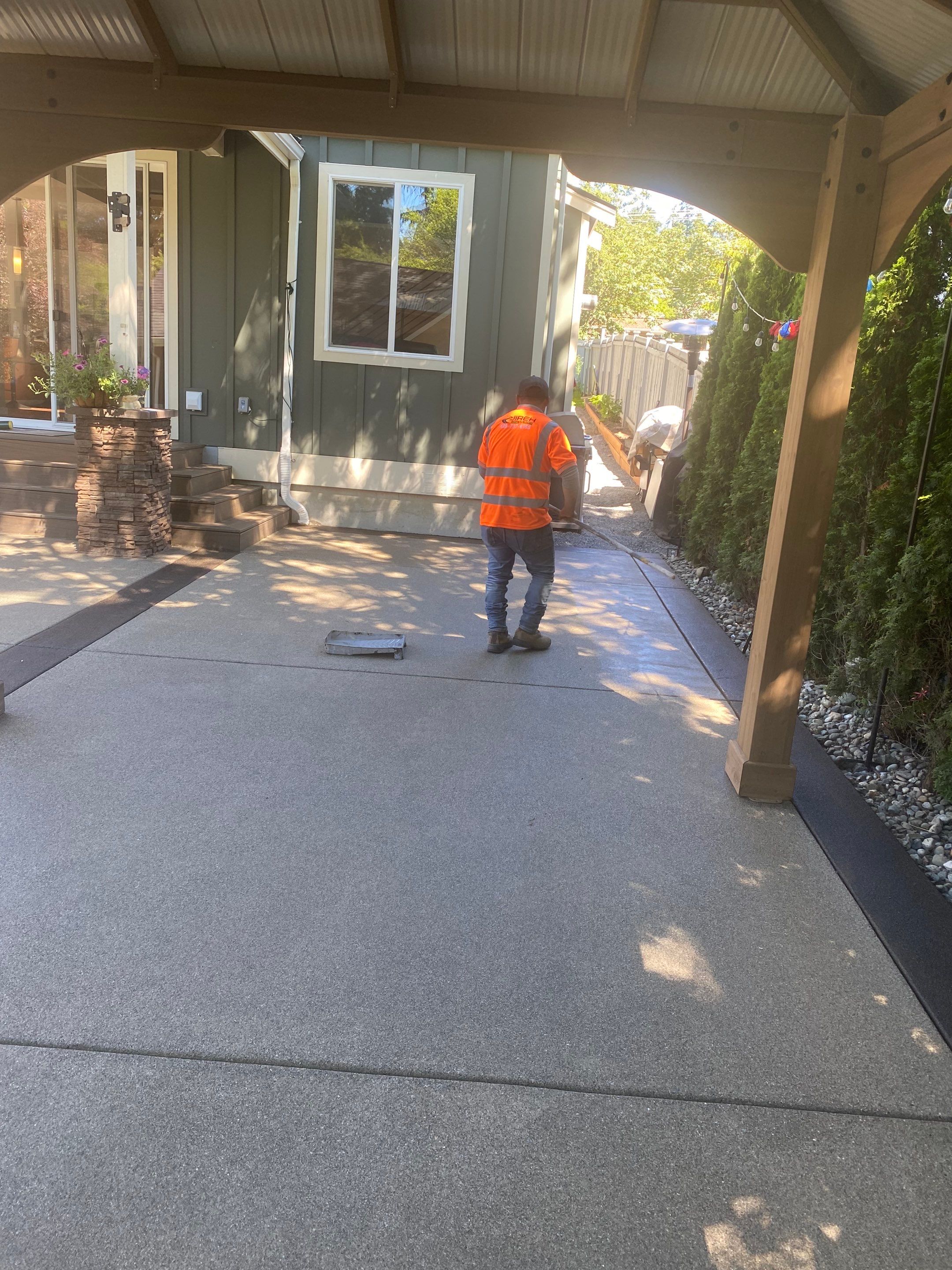 Patio Installation using Concrete, Retaining walls, and Turf install by Jireh Asphalt & Concrete Inc 