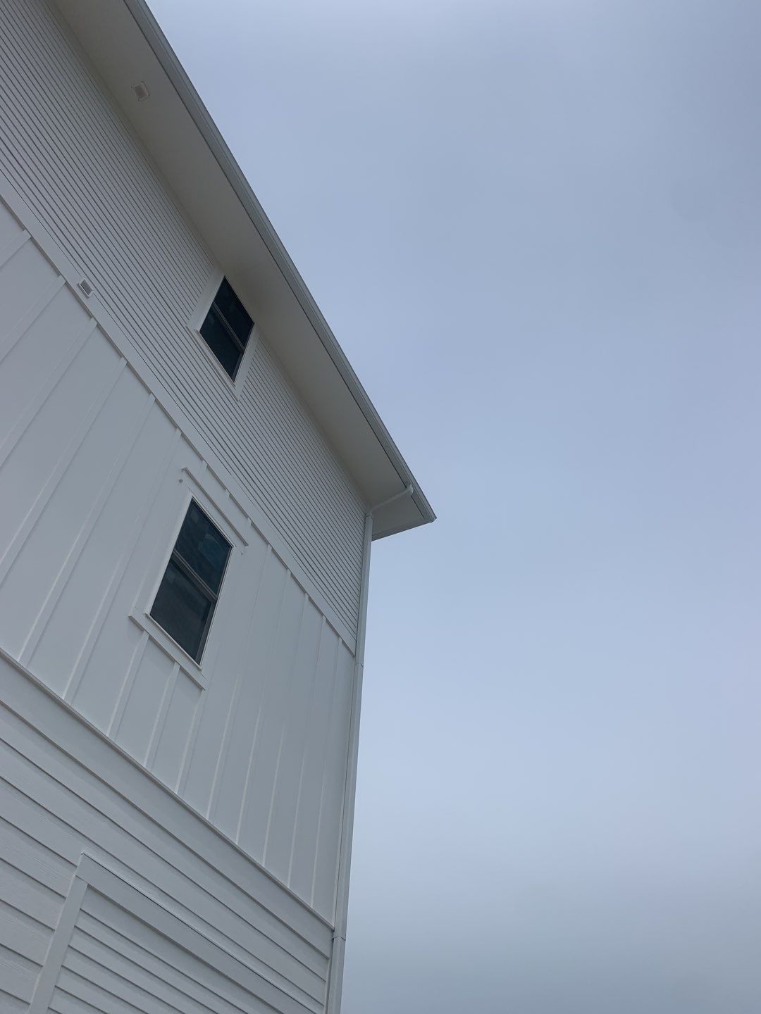 Downspout Installation for Multi-Story Building in Panama City FL by Gutter Professors