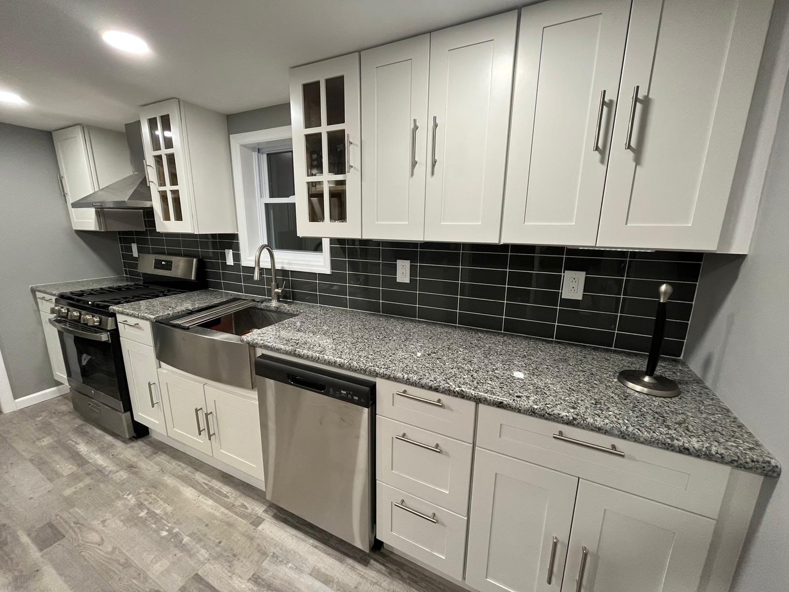 Kitchen Remodel using White Shaker by Home Concepts Construction