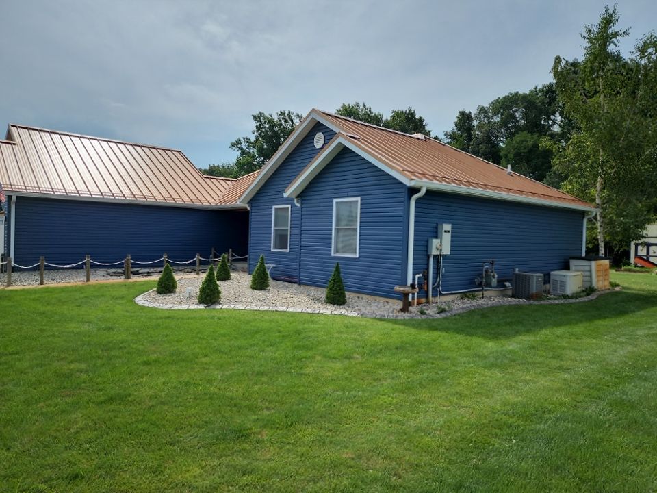 Residential Roofing and Siding Installation using Copper Penny Standing Seam by 4Ever Metal Roofing