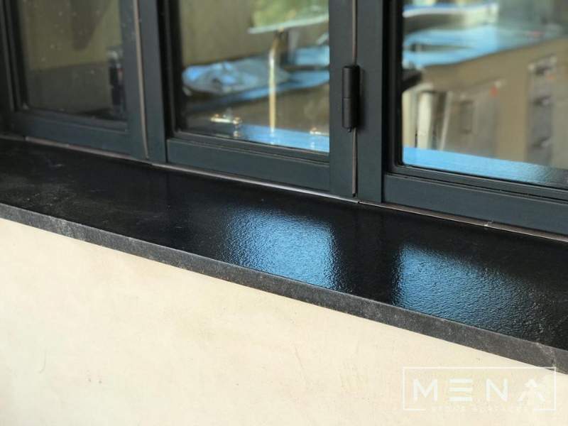 Kitchen, outdoor kitchen and pool brick floor installation by Mena stone surfaces