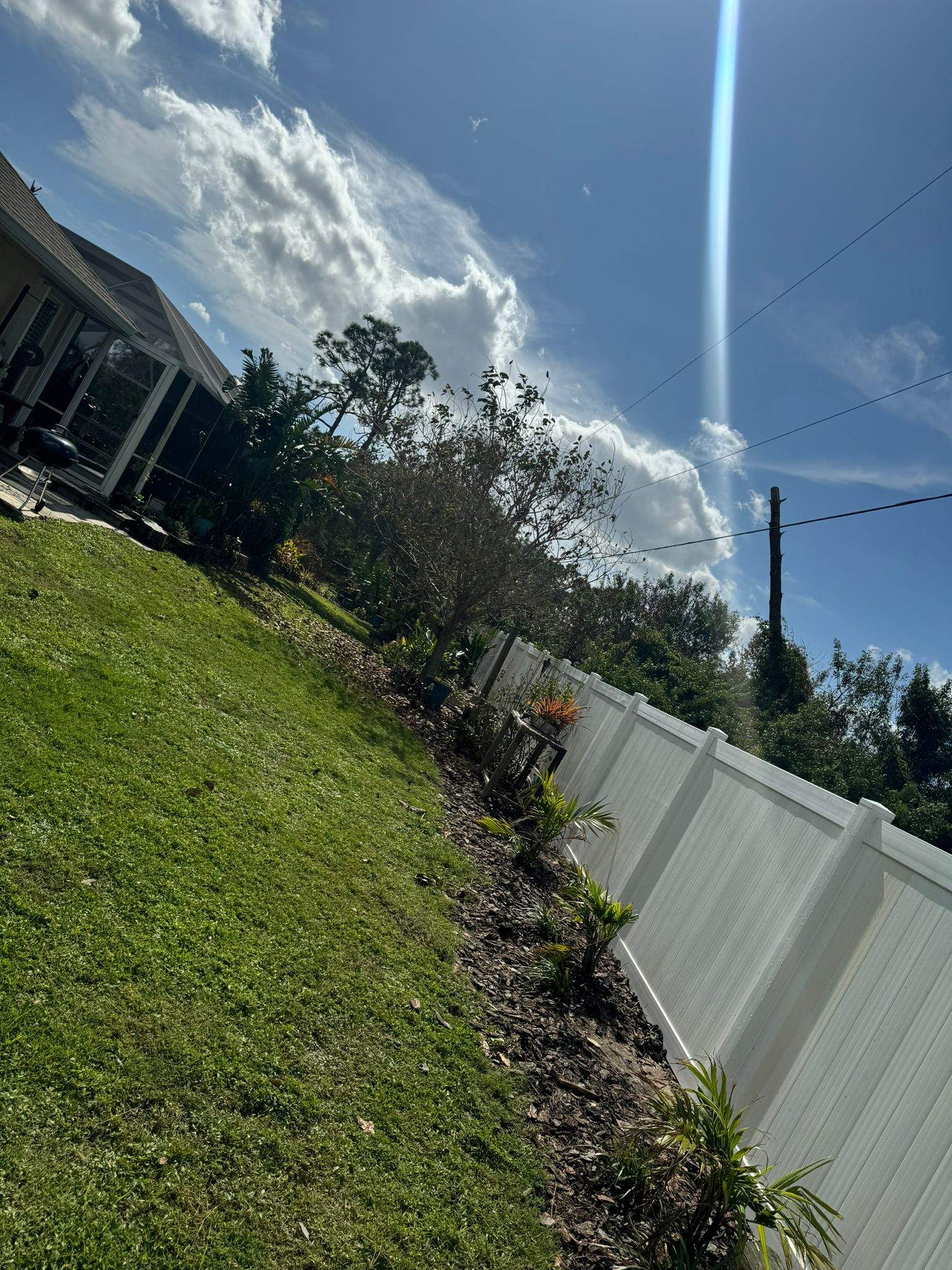 White Vinyl Privacy Fence Installation in Port Charlotte by True Fence LLC