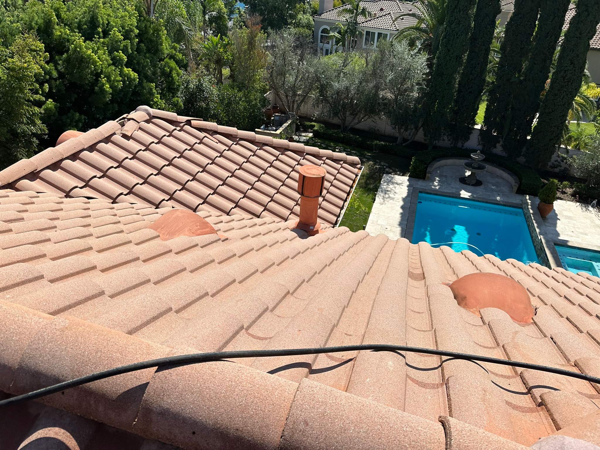 Roof wash on this dirty roof covered in algae by Property Cleaning Experts, LLC