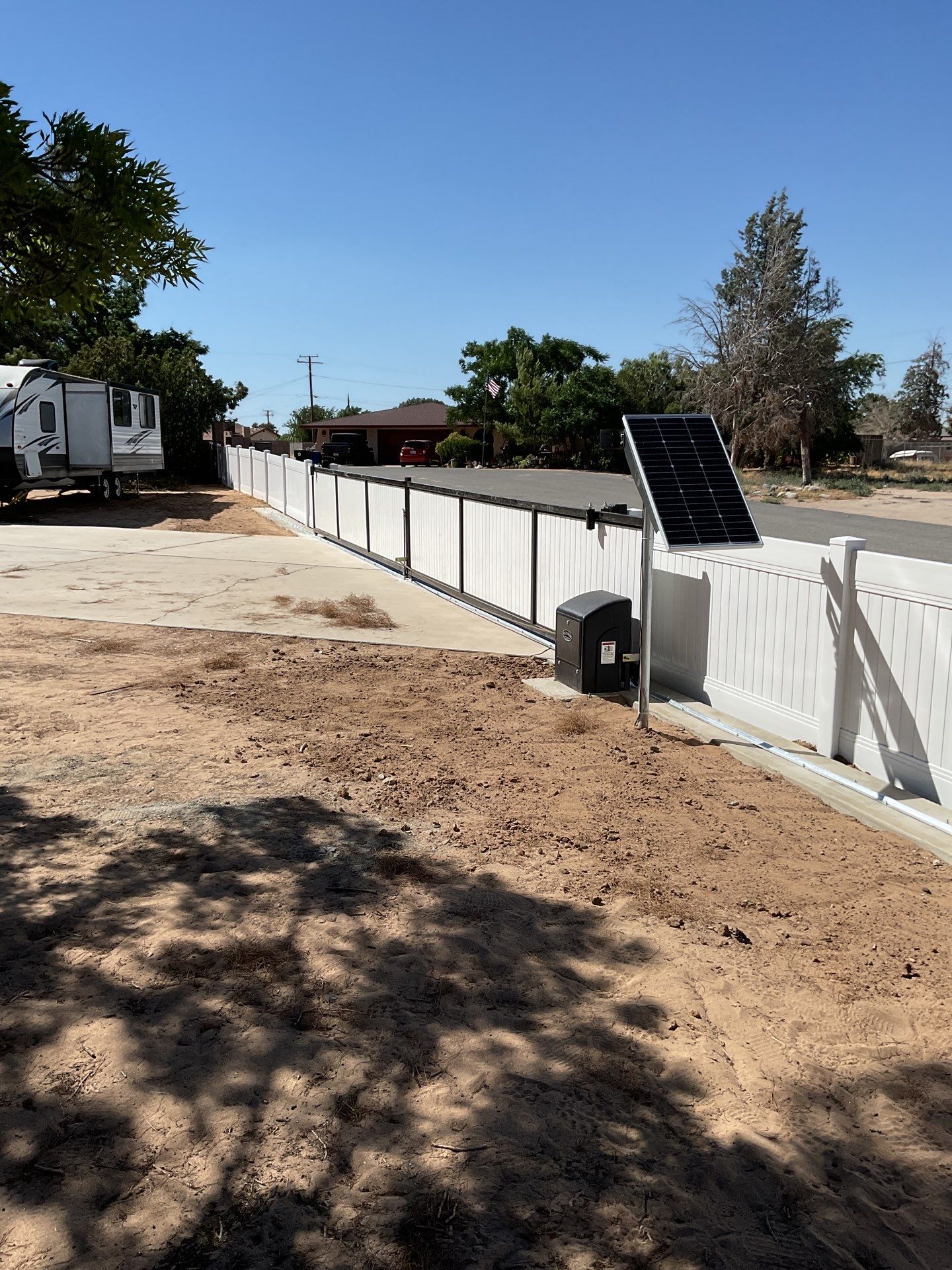 4ft White Vinyl Fence with Solar Power Motorized Gate by Fence Guys Inc.