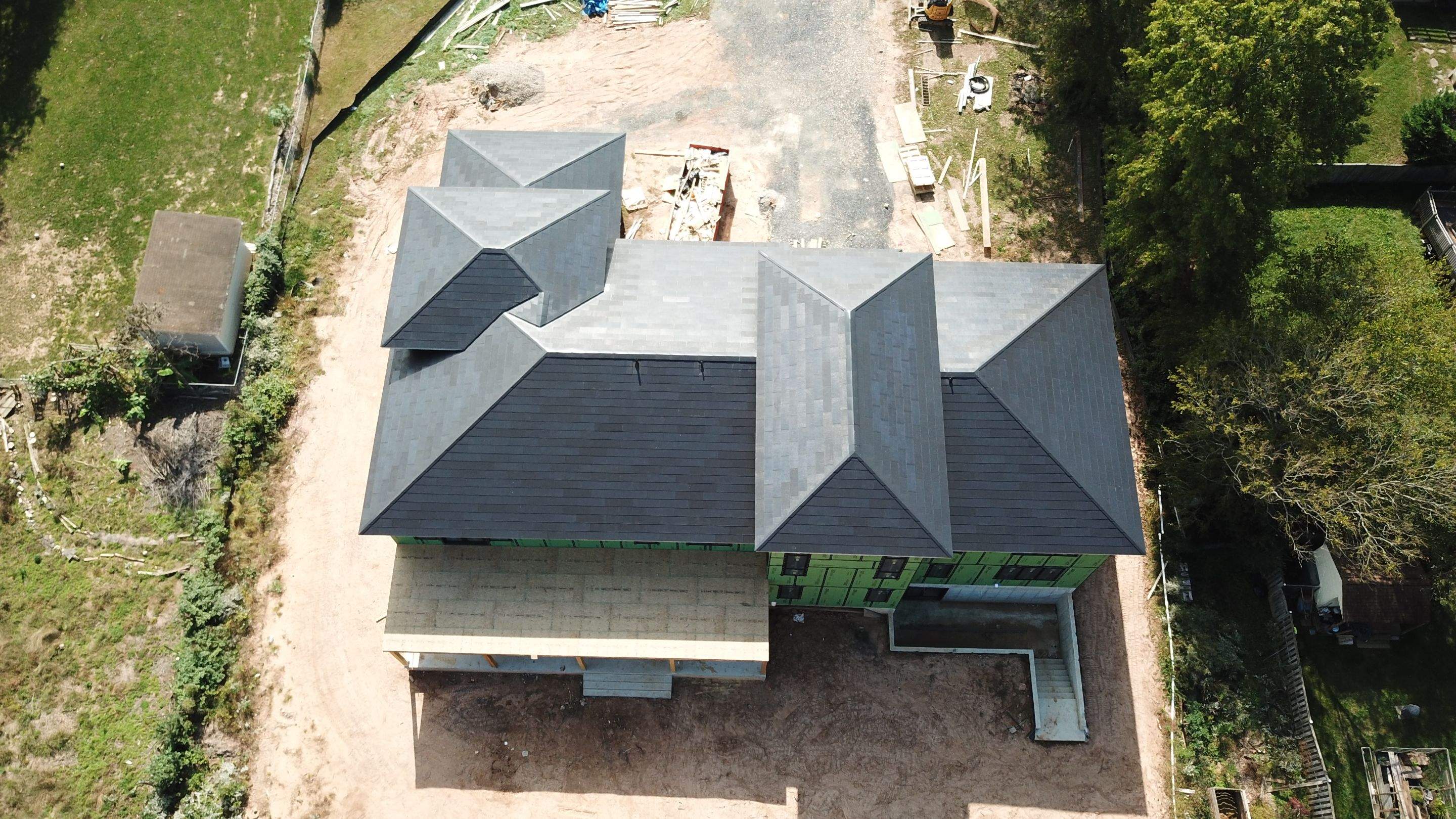 Tesla Solar Roof  using Tesla Solar Roof V3 tiles by American Home Contractors
