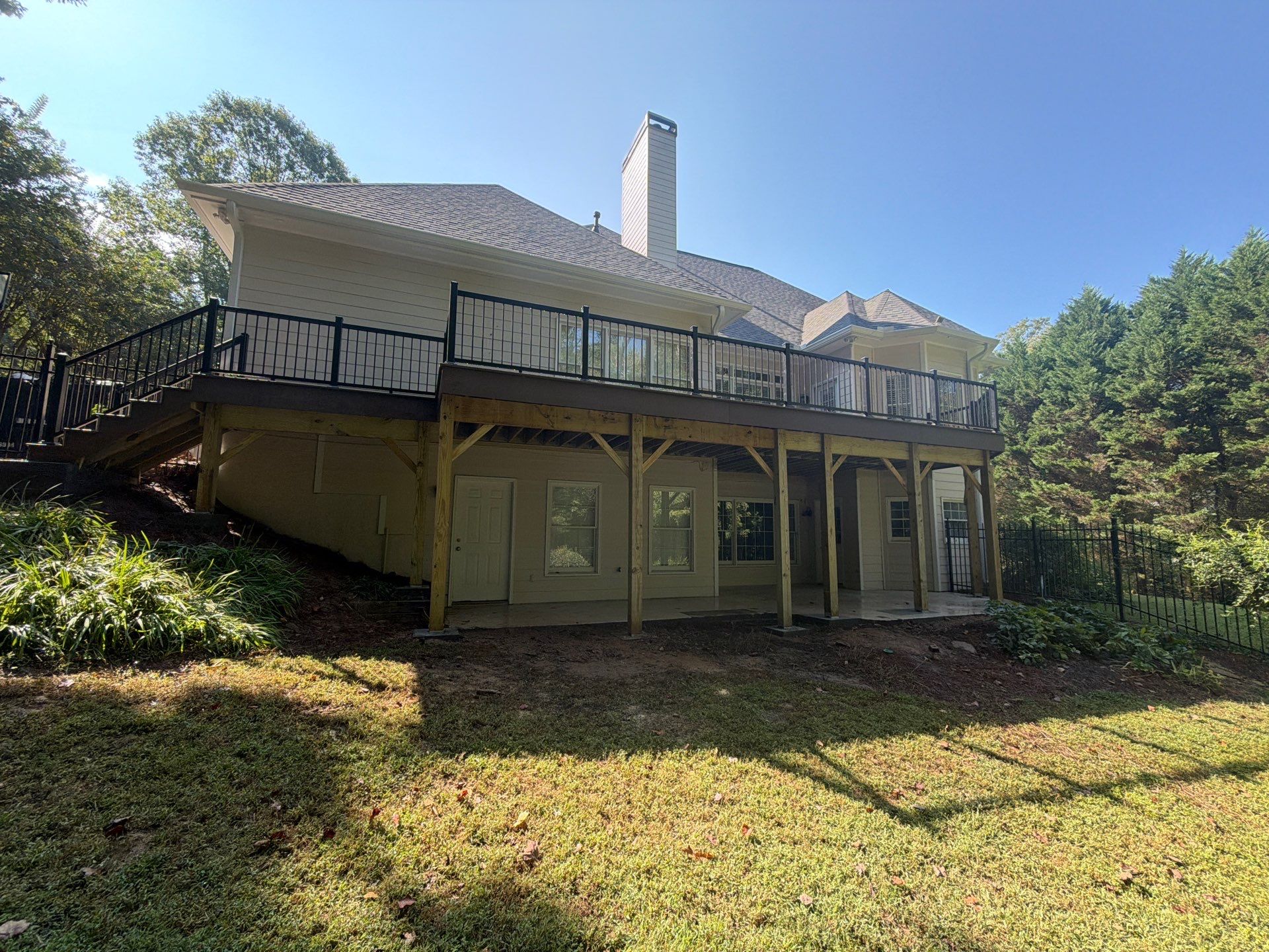 Elevated Composite Deck Replacement with Metal Railings in Smyrna by Swift Home Renovations 