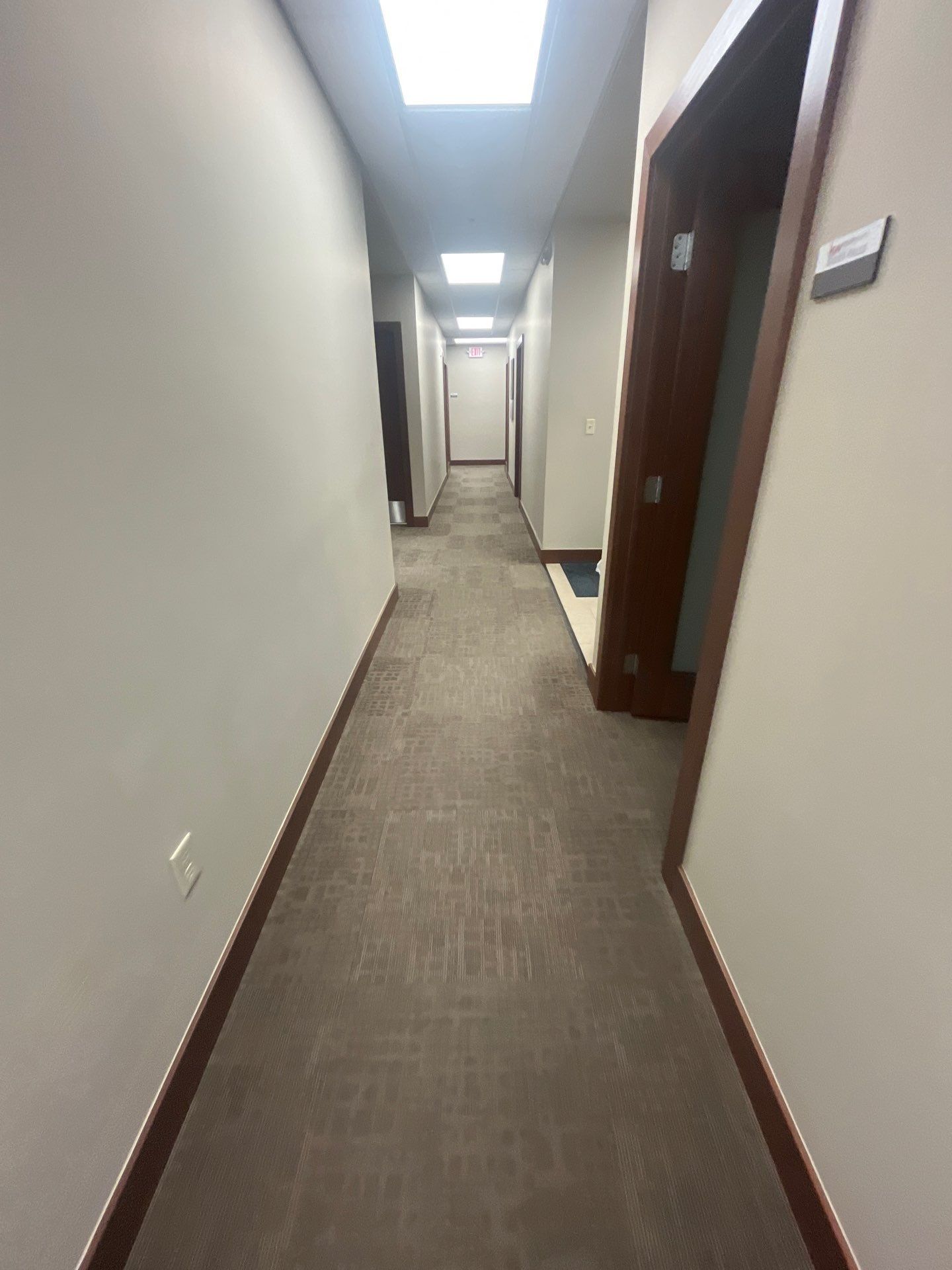 Commercial Office Interior Remodel and Modern Suite Refresh in Sioux Falls by Select Painting, Coatings & Garage Cabinets