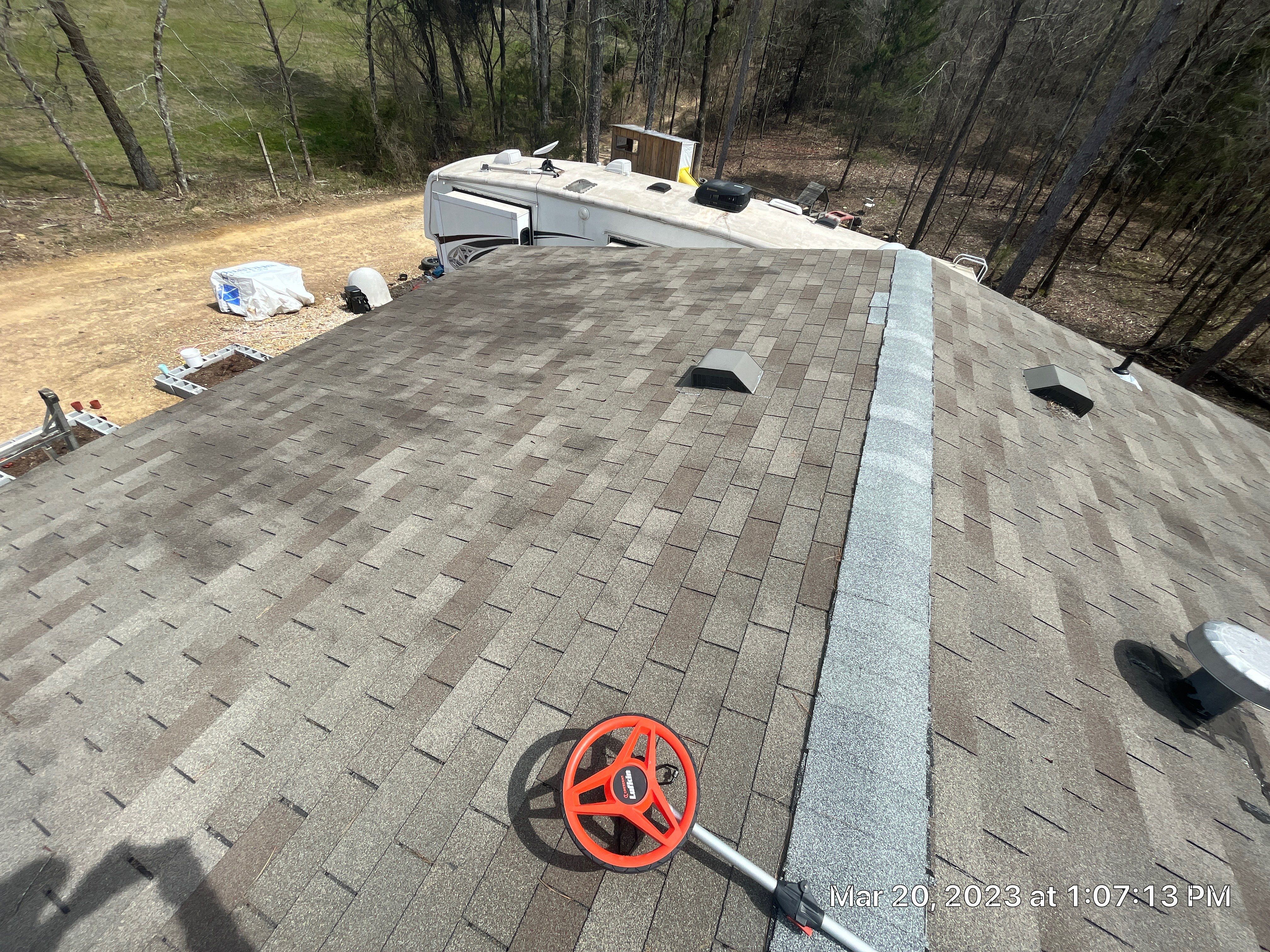 Residential Roofing Installation using 26 Gauge Colored Panels by Hostetler Roofing