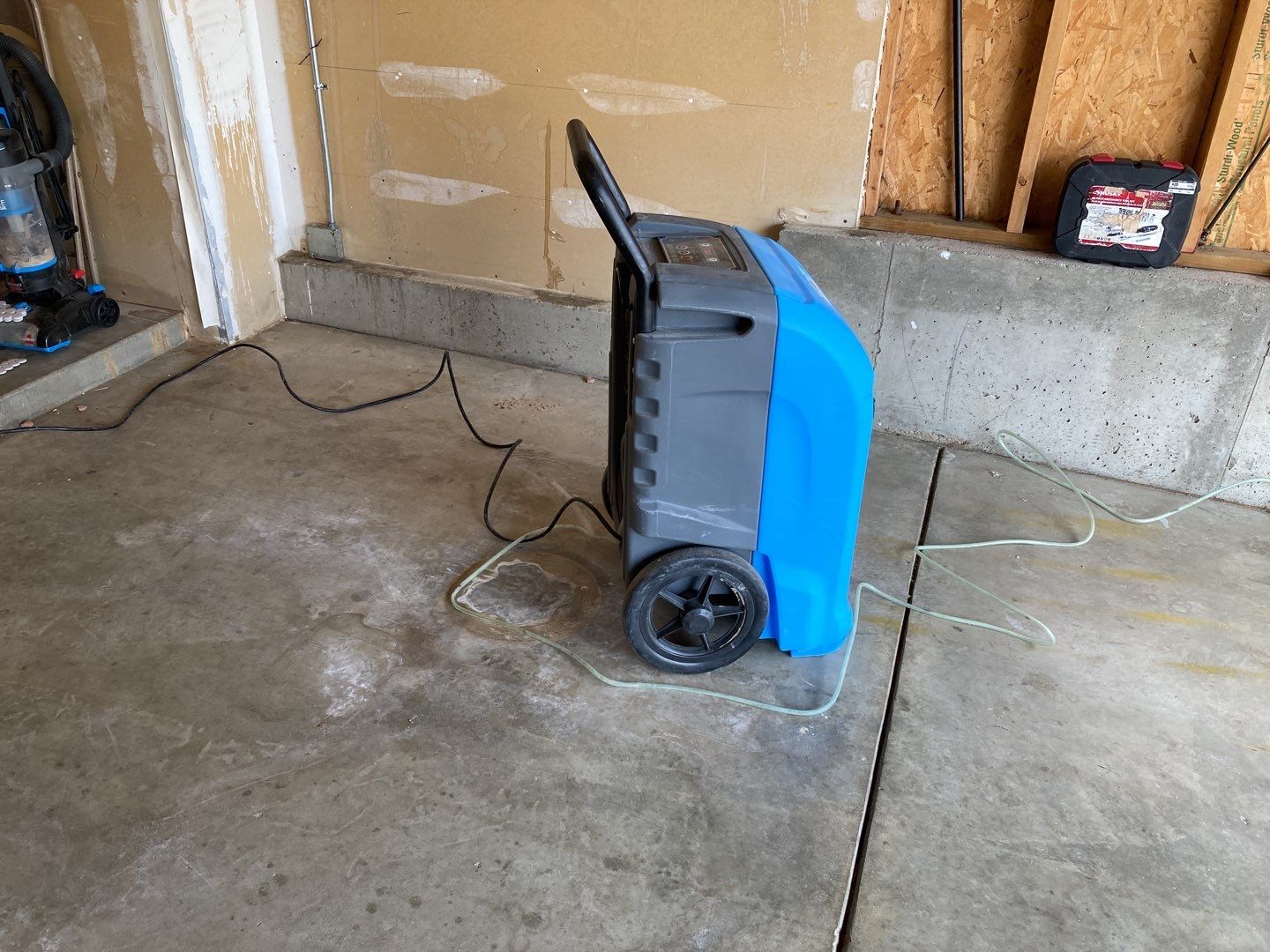 Water Damage in Garage by Accountable Home Services