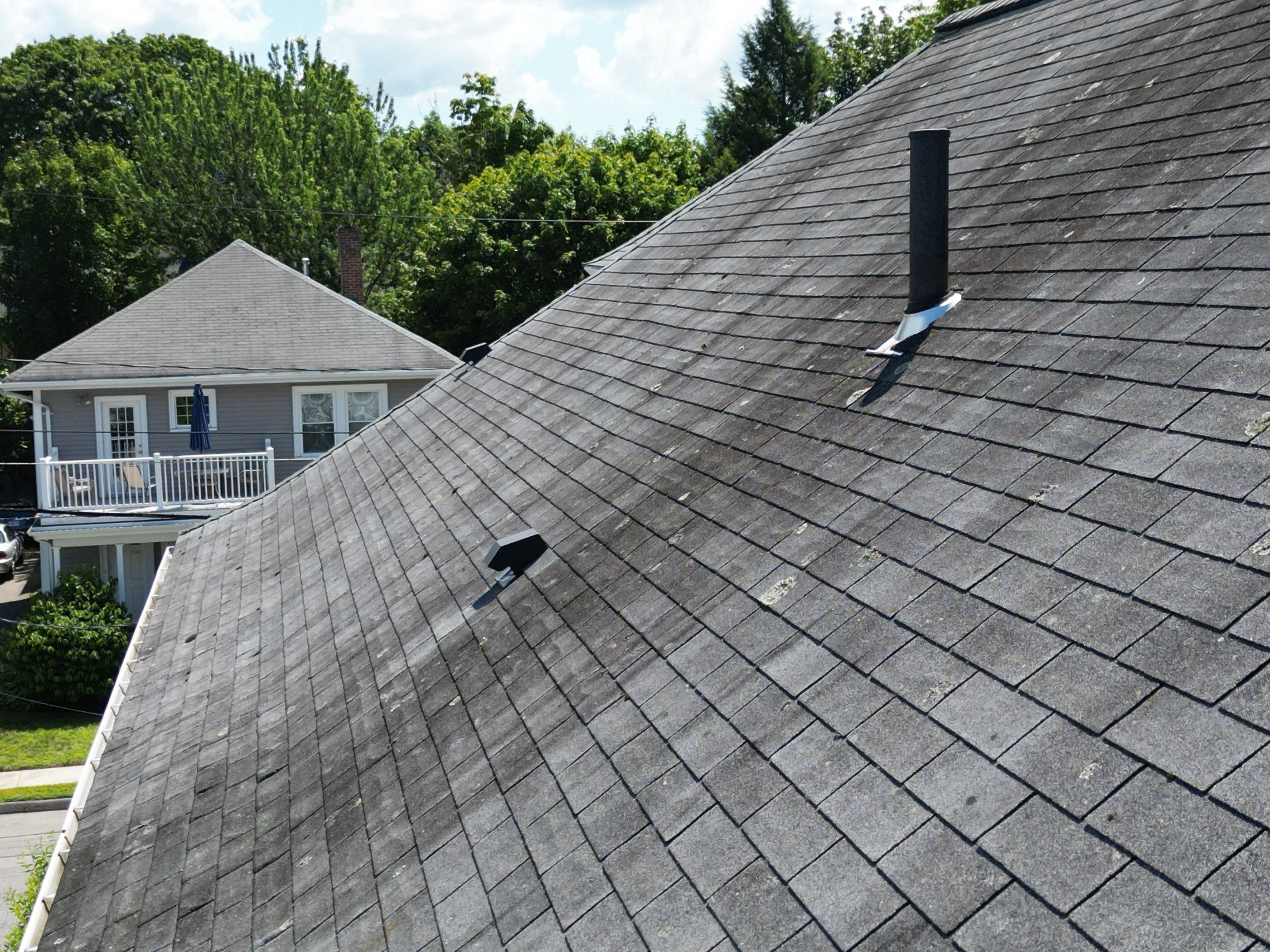 Roof Replacement with Skylight Flashing in Waltham, MA by Mighty Dog Roofing of Greater Middlesex County